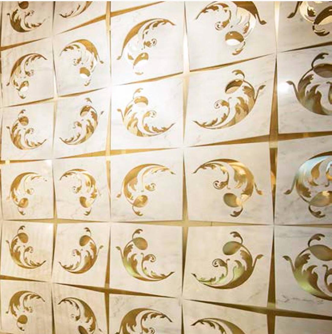 Marble architectural wall feature in Italian marble with brass features and backlighting.

This wall cladding is dynamic while remaining static as a work of art while functioning as a wall divider. Created in Crema delicate marble and enriched