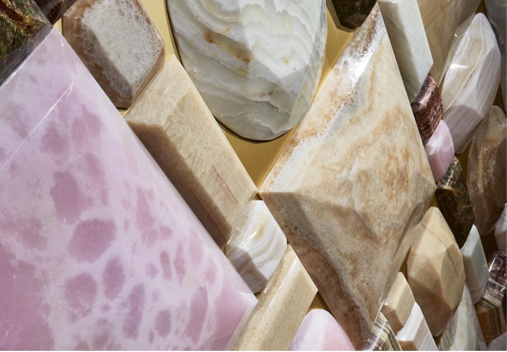 All the elegance and refinement of a blend of natural color Onyxes, with their different origins, are brought to new life in this wonderful style creation, the essences, like diamonds, are set the one next to the other, skillfully chiseled to exalt