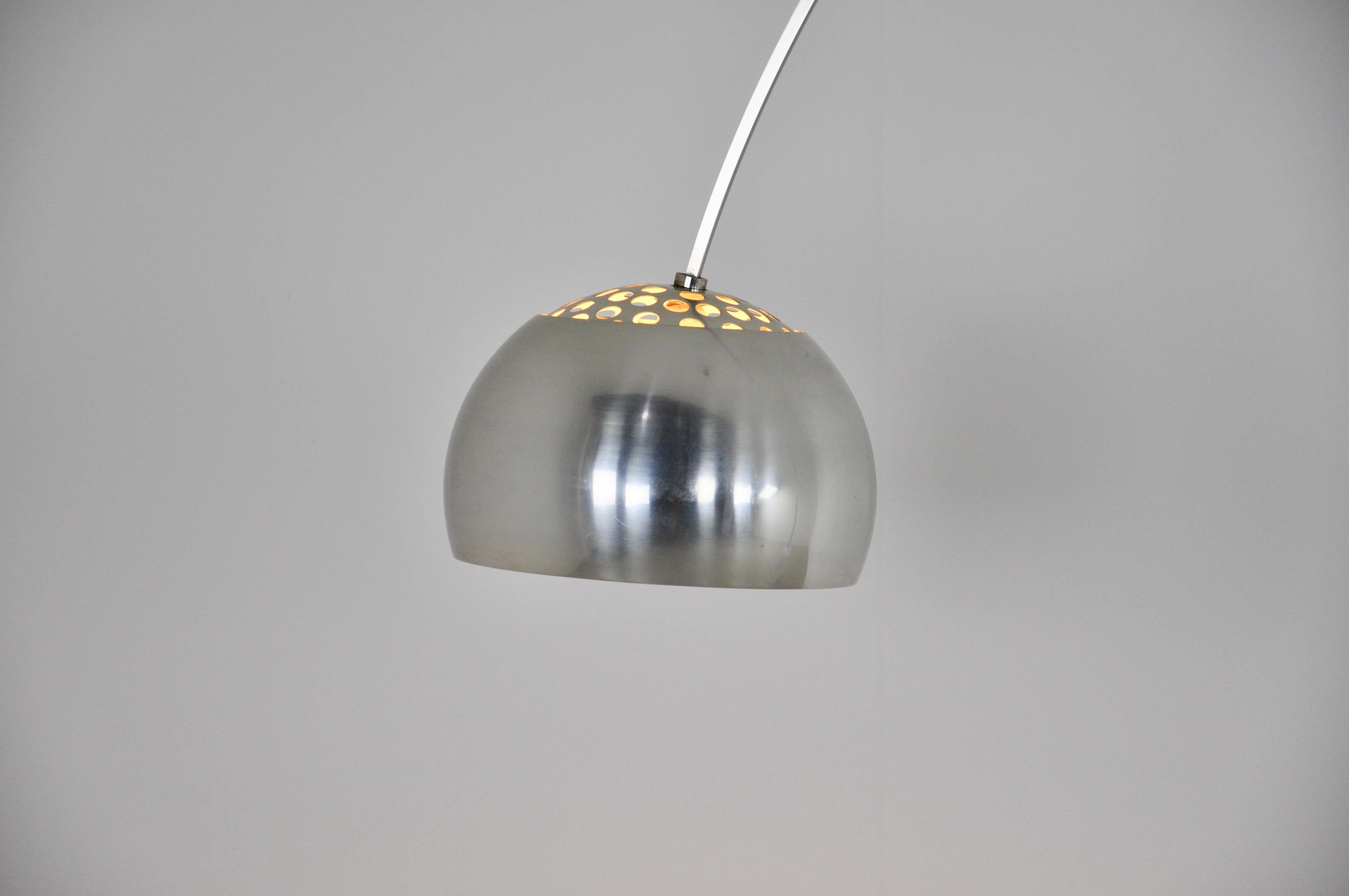 Arched floor lamp. Carrara marble base, metal structure. Stamped Floss. 
Wear due to time and the age of the lamp post.