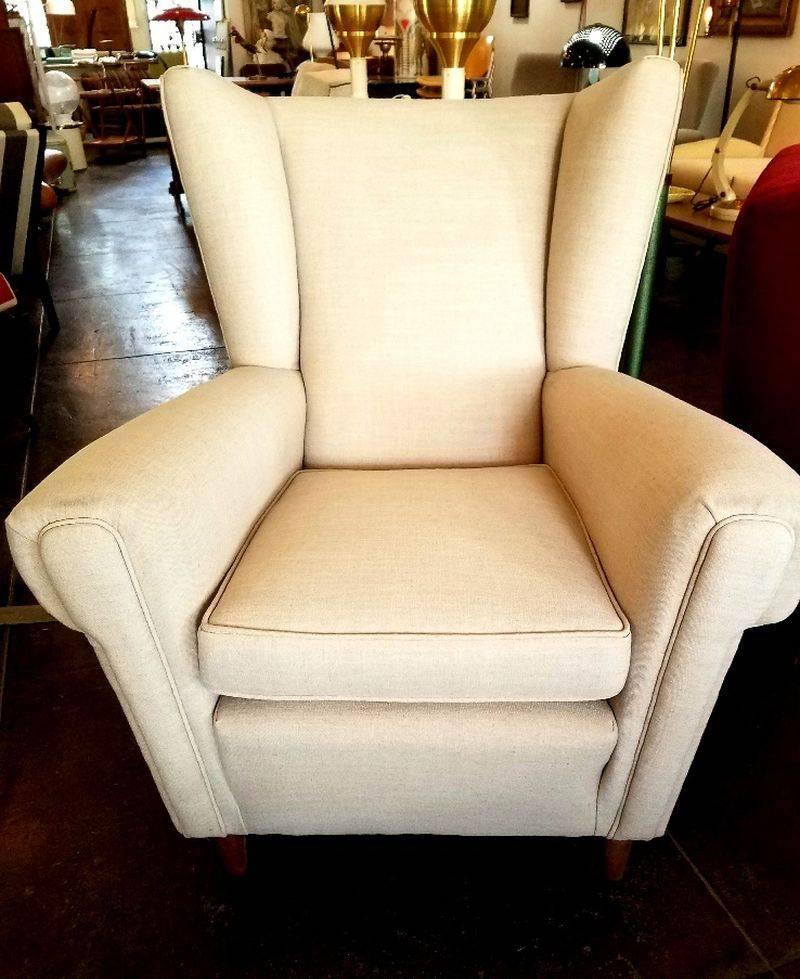 Italian armchair 1940s attributed to Gio Ponti. Chair and ottoman reupholstered. The ottoman was add to original chair later.Italian sophisticated look addition  to your home .
Ottoman dimension:
Width: 23.5, depth 19.5, height 14.5.
 