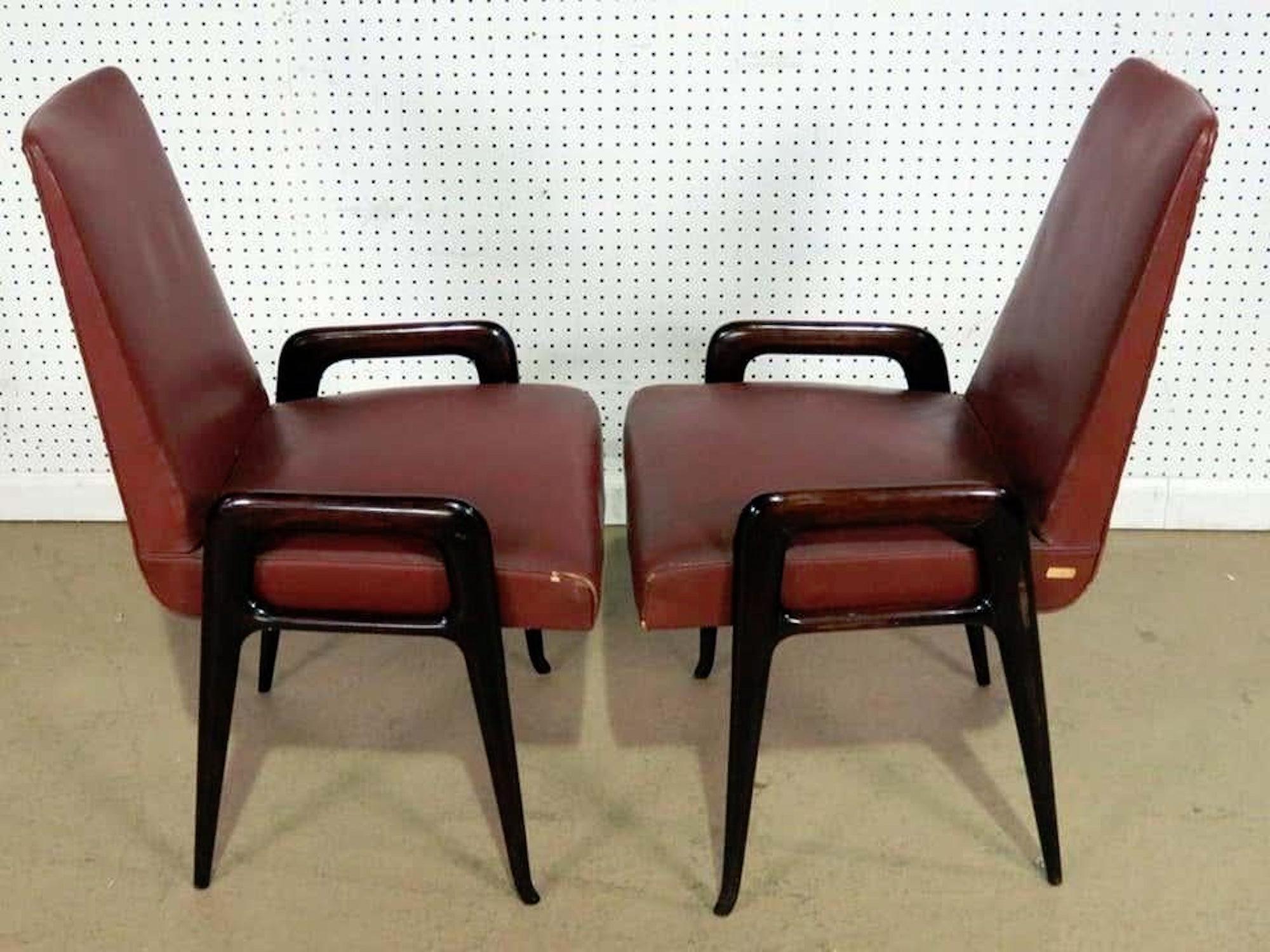 Pair of vintage Italian armchairs with rosewood frame and distressed leather with nail head trim.
(Please confirm item location - NY or NJ - with dealer).
 