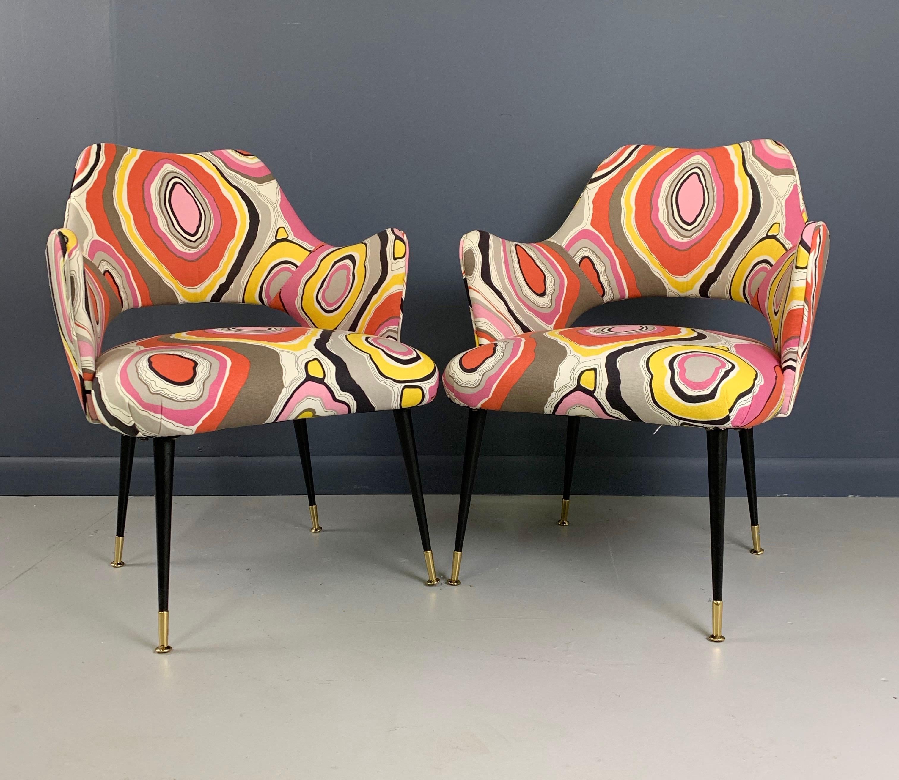 Clothed in Pucci inspired fabric these two arm chairs are exquisite and exciting. They will add an element of interest in any decor.

These chairs were produced in that magical period of mid century masters that includes: Ico Parisi, Gio Ponti, Paul