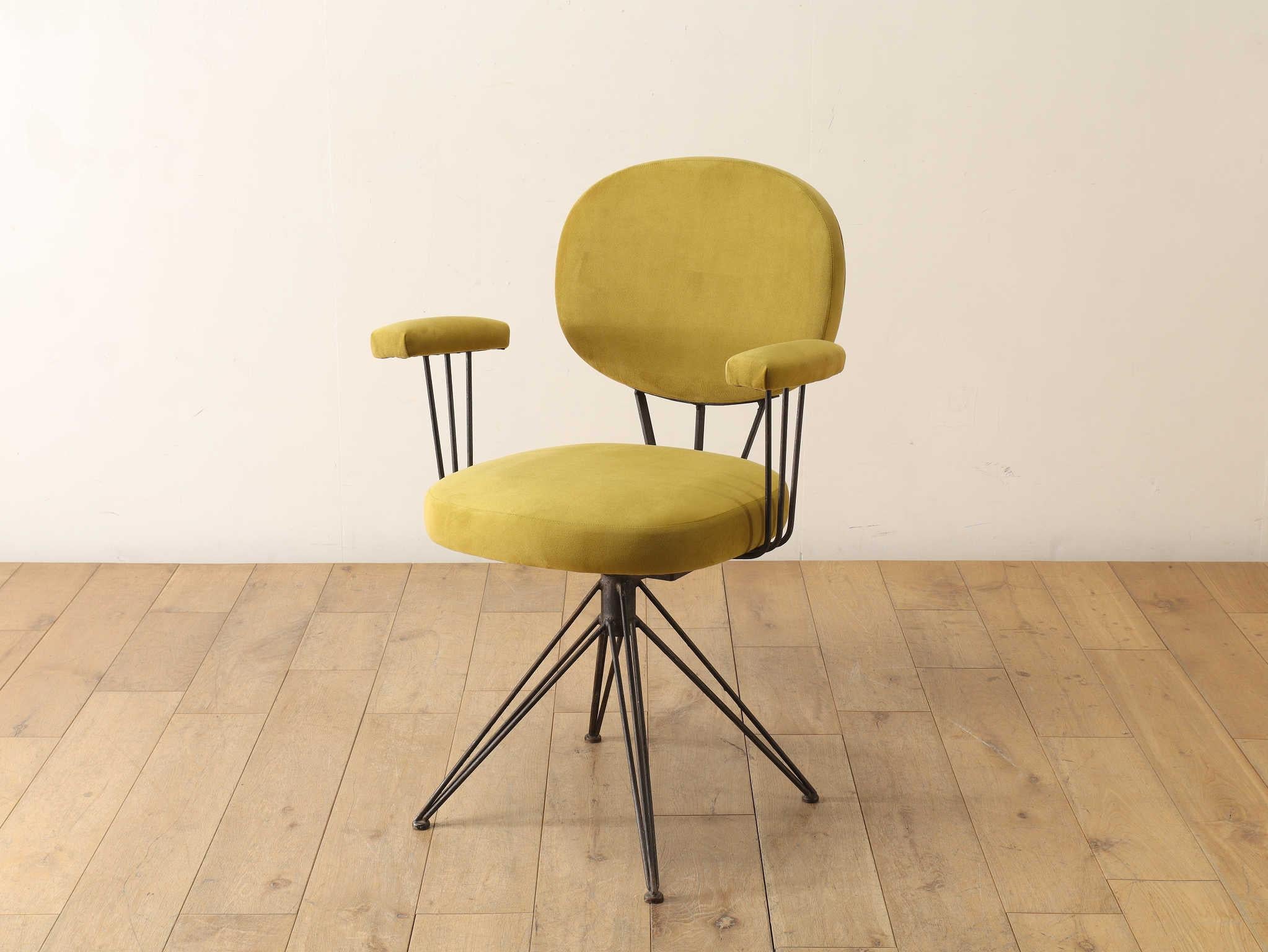 This armchair features a sharp, modern design that reflects Italian sensibilities. Its linear form is composed of multiple slender metal frames, creating a clean and striking silhouette. Ideal for pairing with a desk, this chair is designed with