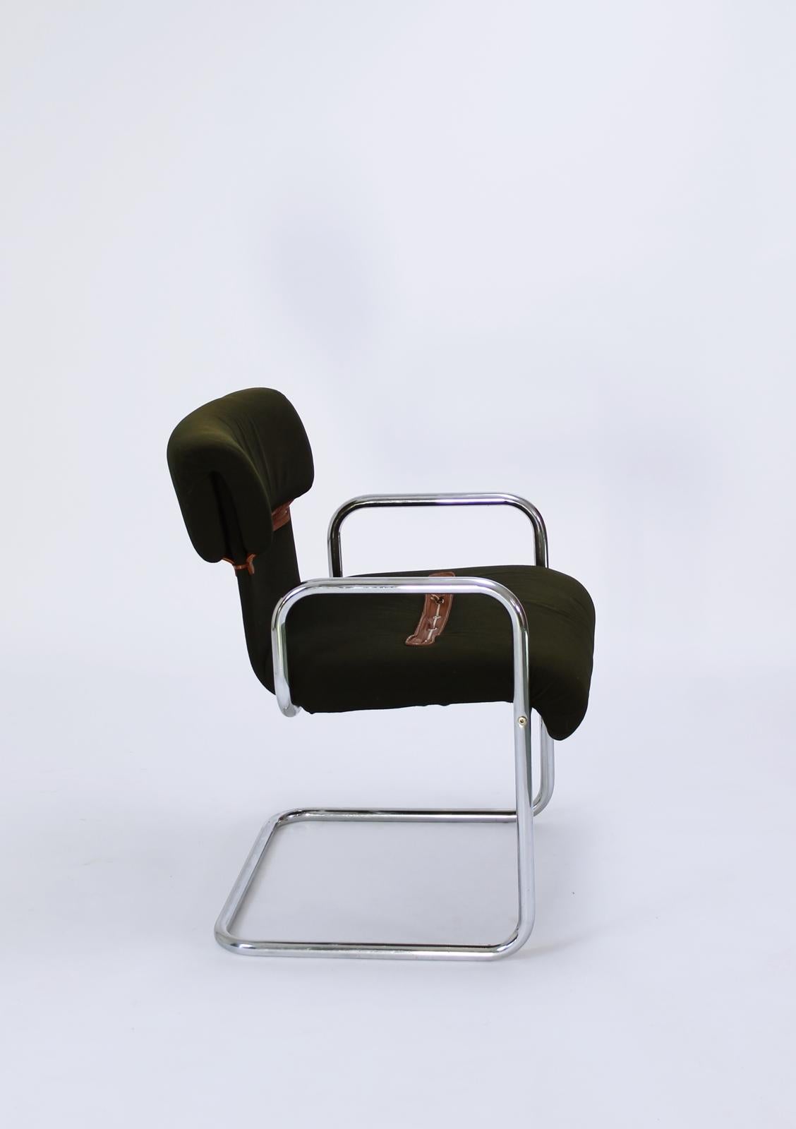 Stunning cantilever armchair on curved tubular steel legs features dark 
 green colored fabric upholstery with braided detailing on the backrests and seats.
Retailed by Hermes, circa 1970

As found condition: the seat has a very small hole.

.