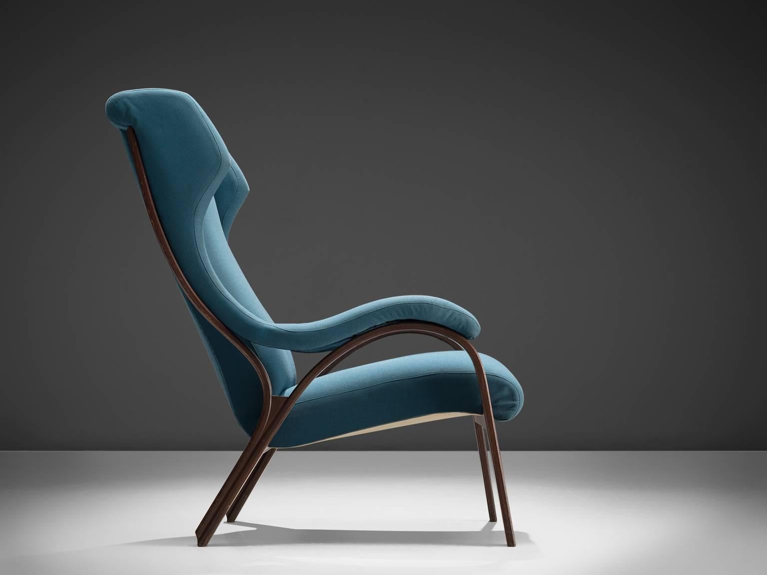 Cinova, easy chair, walnut and blue fabric, Italy, 1950s.

This Italian armchair produced by Cinova, is part of our Italian midcentury design collection. The chair features curves and gracious forms. The most interesting feature is the petrol