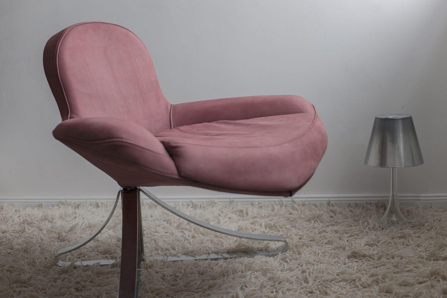 Unique and stunning Italian armchair, inspired by the graceful curves of a Venus shell. This extraordinary piece of furniture is sure to be the centrepiece of any room, with its sculptural lines and pure elegance. 

This armchair is not only a