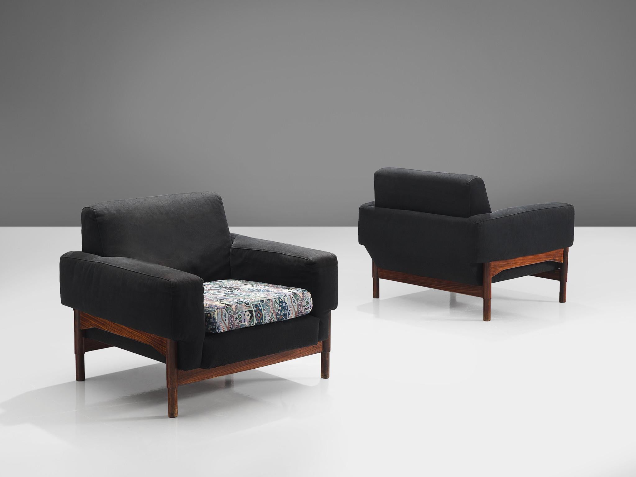 Pair of lounge chairs in black and graphic upholstery, rosewood, Italy, 1970s.

This elegant, geometric pair of lounge chairs feature a graphic pattern on the seat and a black fabric on the rest of the chair. The eloquent detail on these chairs is