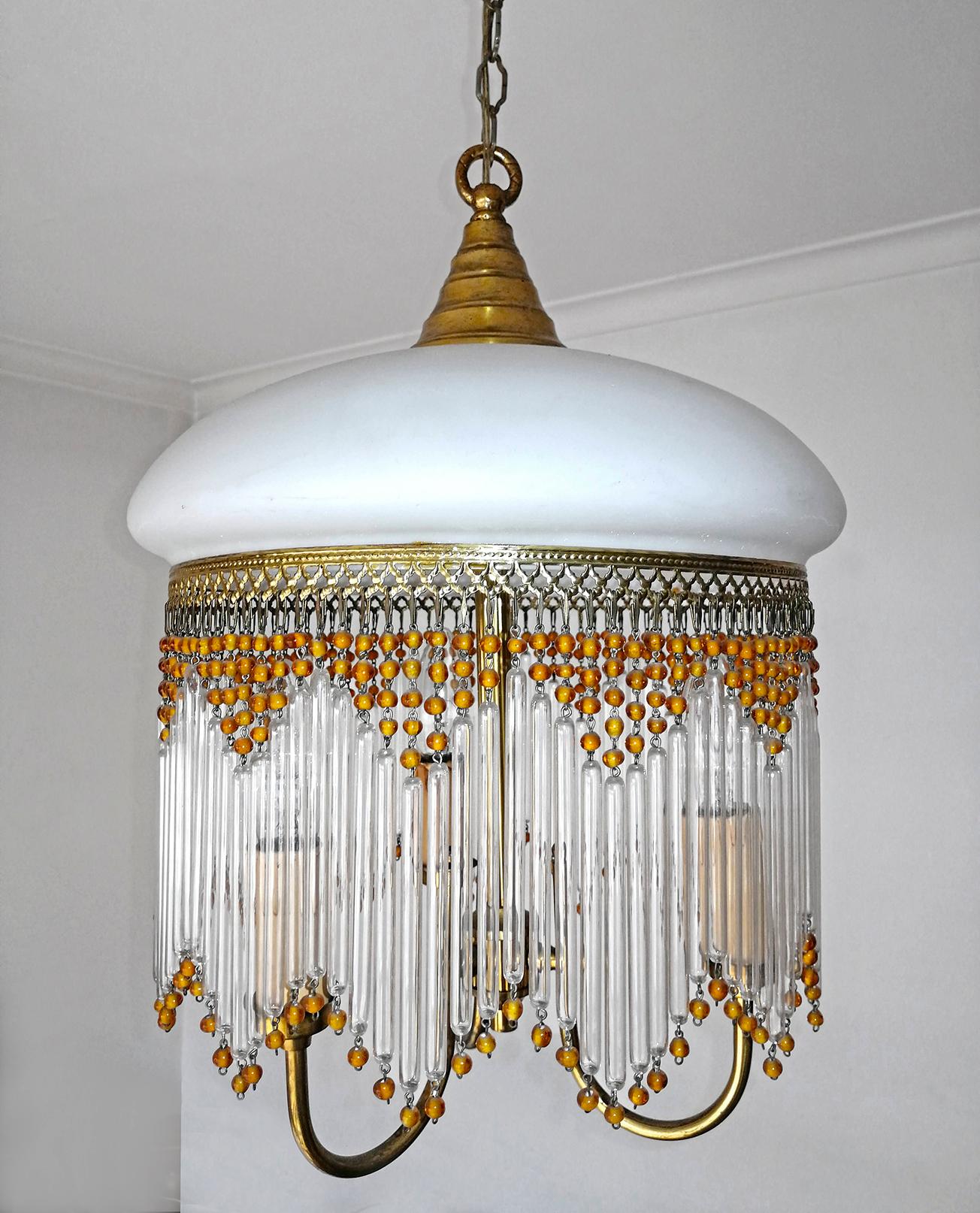 Beautiful Italian midcentury in clear and Murano beaded glass Art Deco / Art Nouveau chandelier.
Measures:
Height 31.5 in. (chain/10 in)/ 80 cm (chain/25 cm)
Diameter 13 in. (33 cm)
3-light bulbs E14/ good working condition.
Age