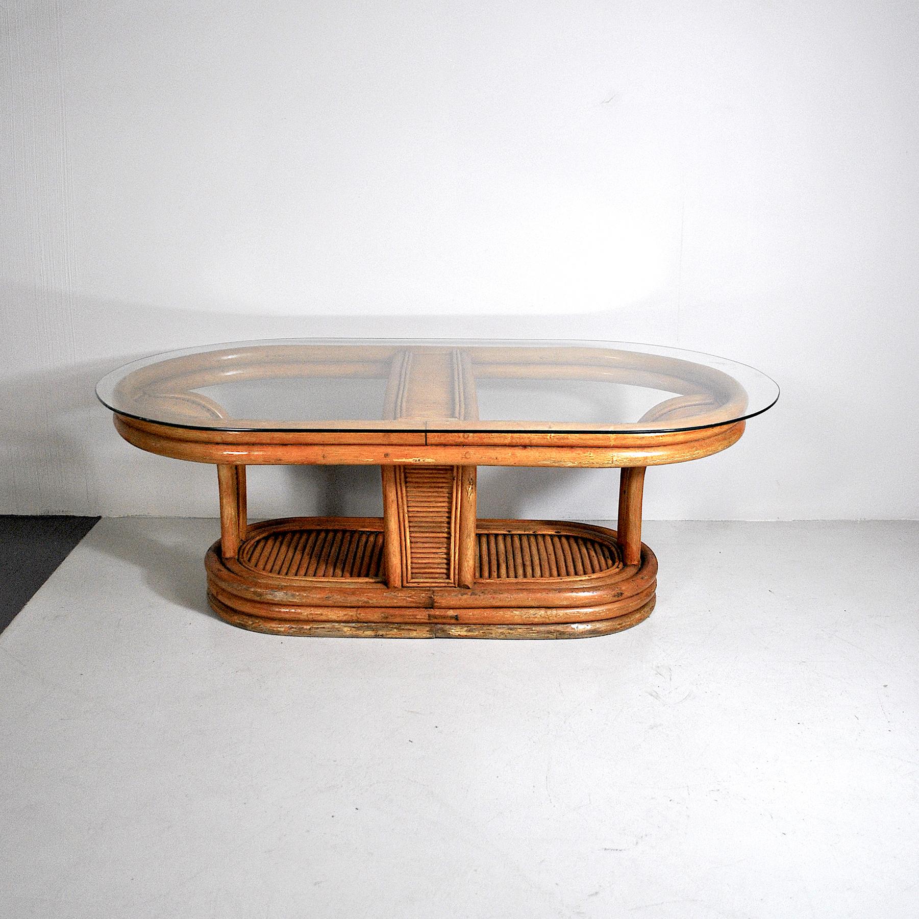 Oval bamboo coffee table belonging to the Italian Art Deco of the 1940s.