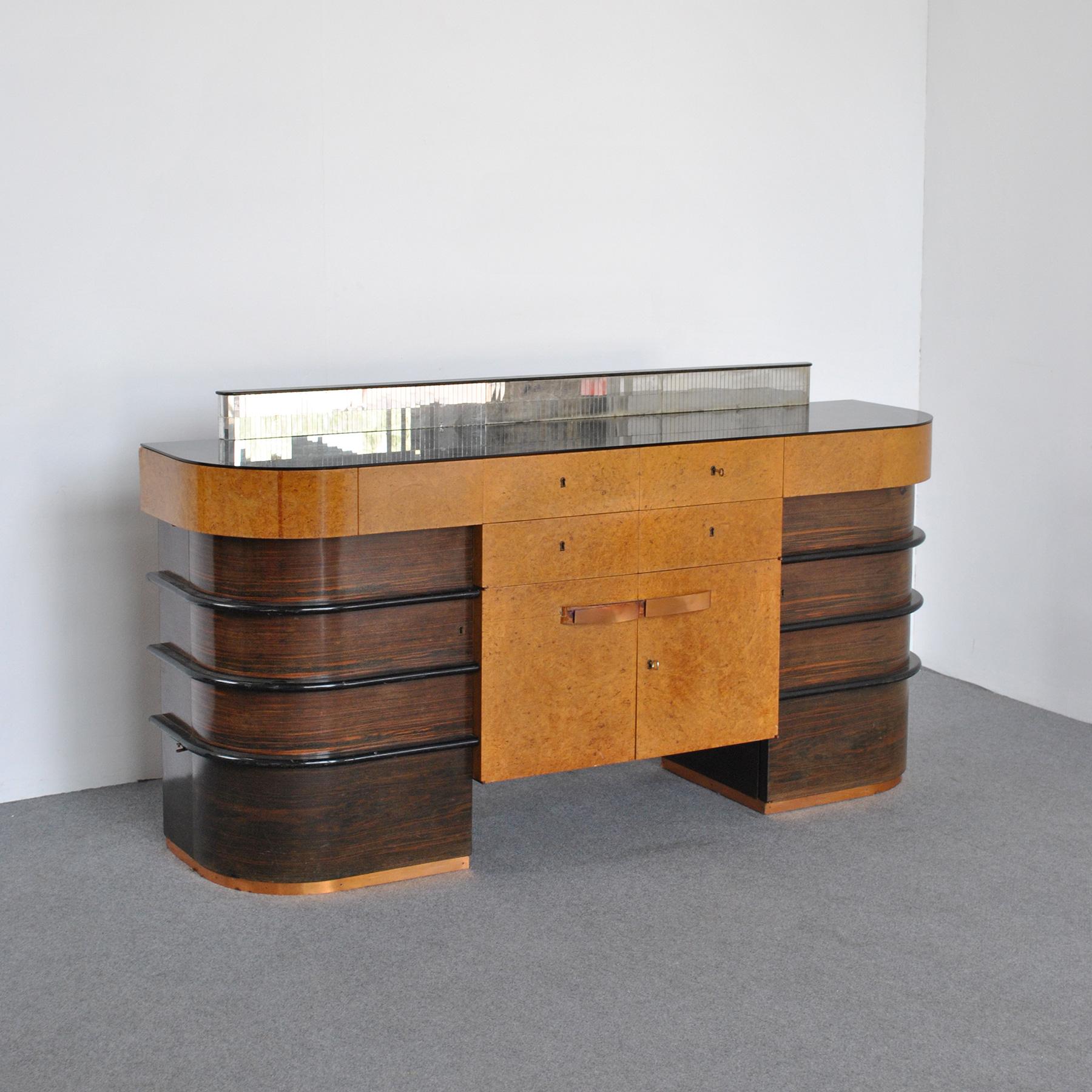 Walnut burl wood cabinet with black colored glass top with six drawers, two front doors with locks and two curved doors worked in pure Deco style at the end of the 40s.