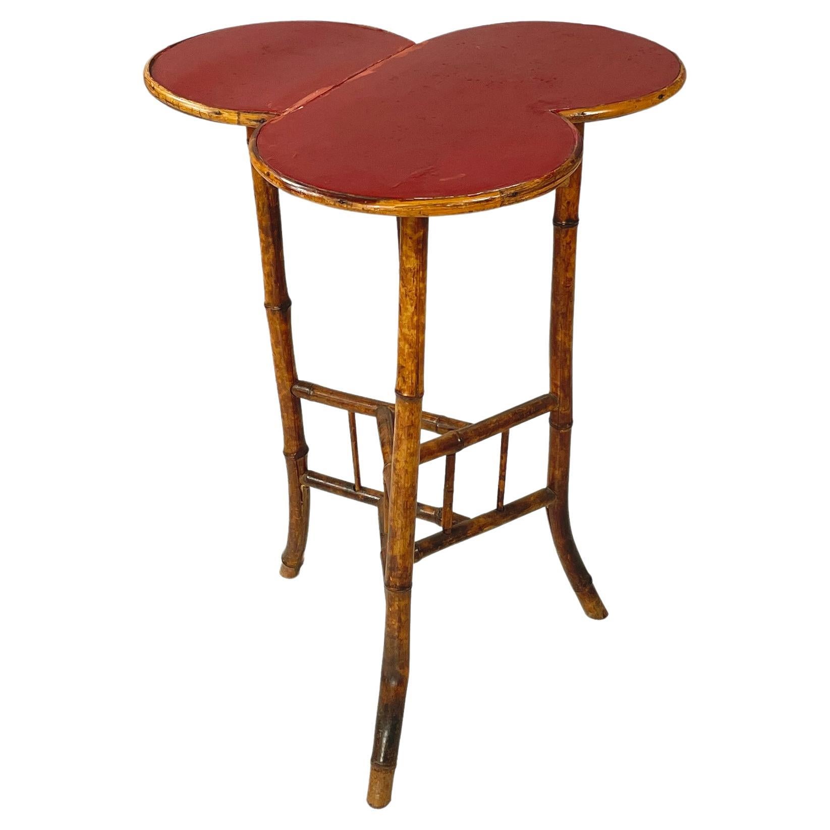 Italian art deco Coffee table with red wood clover top and bamboo, 1900-1950s For Sale