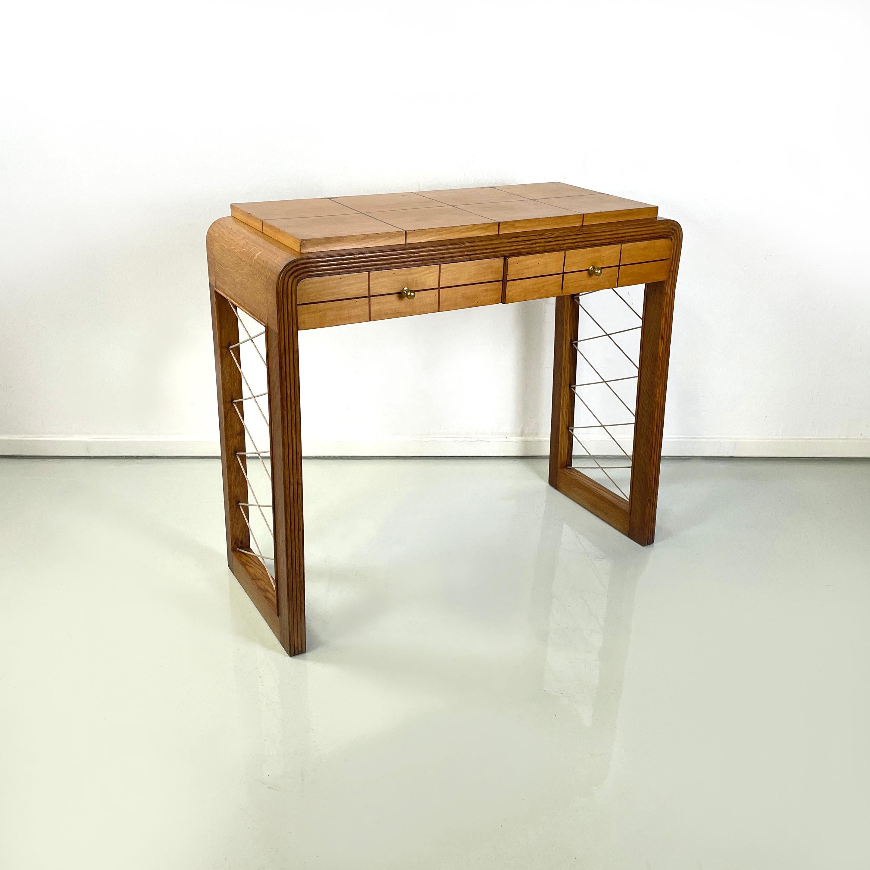 Italian art deco Console in wood with rope geometrical details, 1950s
Console table with rectangular wooden top with linear black wooden details. The wooden structure has a breadcrumb on the front and rounded corners. On the front it has two drawers