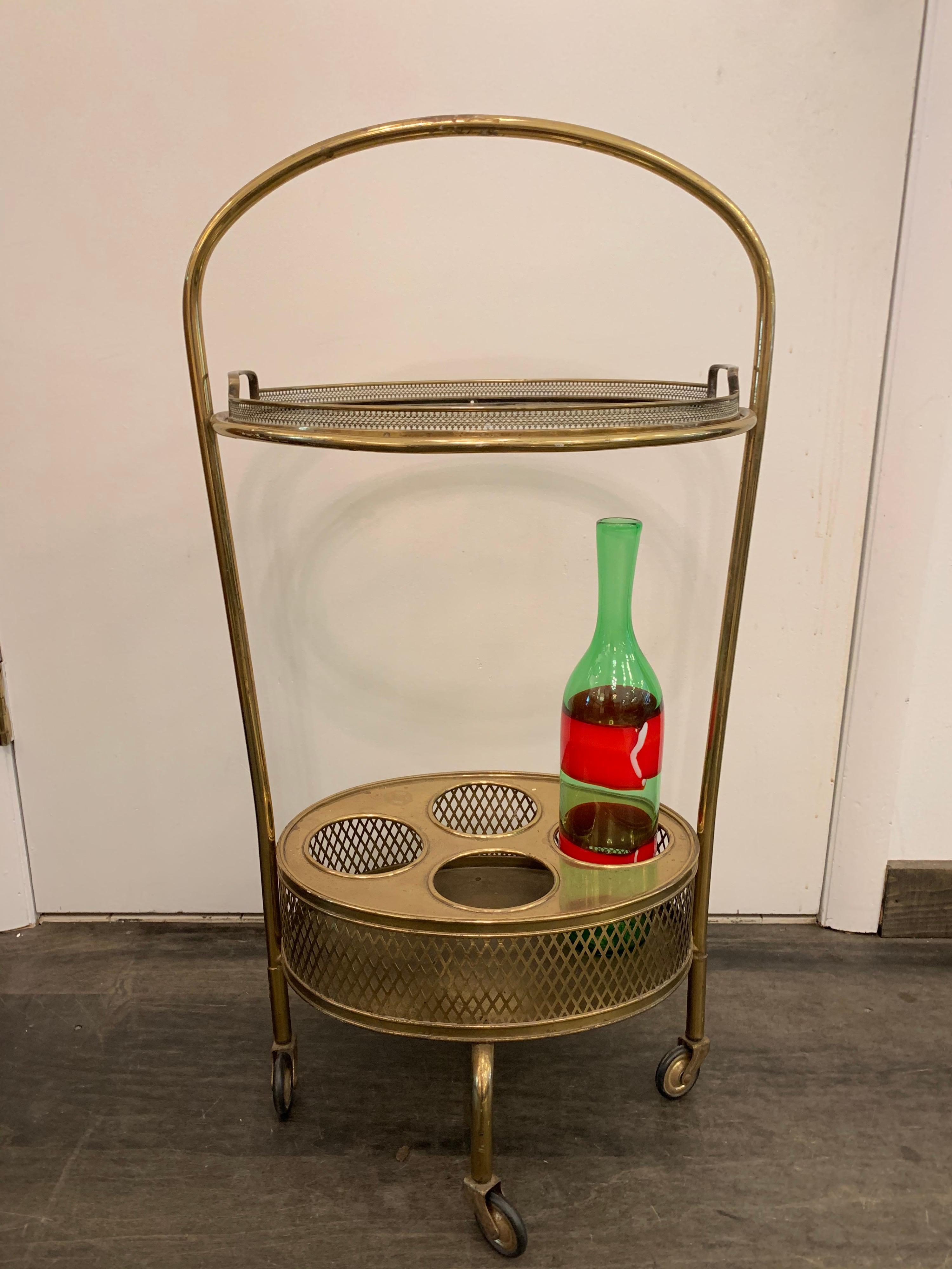 Whimsical bar cart on casters with lower level 4-bottle holder and top level removable oval serving tray.