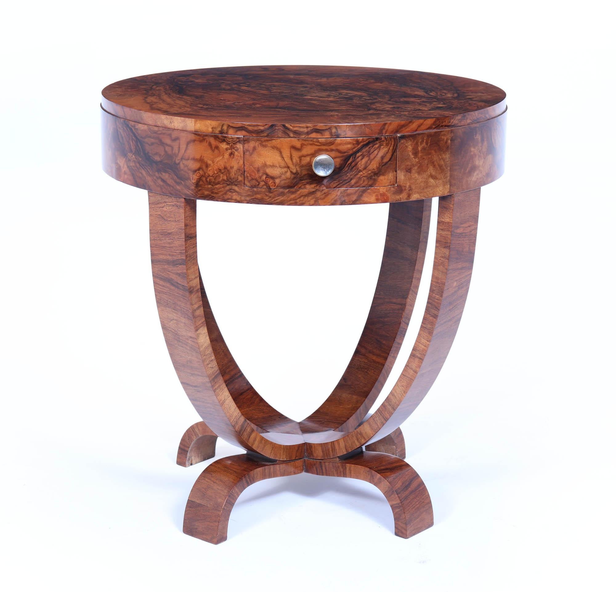 Art Deco Drum Side Table 
A lovely round Art Deco Table produced in Italy in the 1930’s in figured walnut, having four curved upright supports and “drum” top with drawer the table is most commonly used as a Games Table storing the pieces in the
