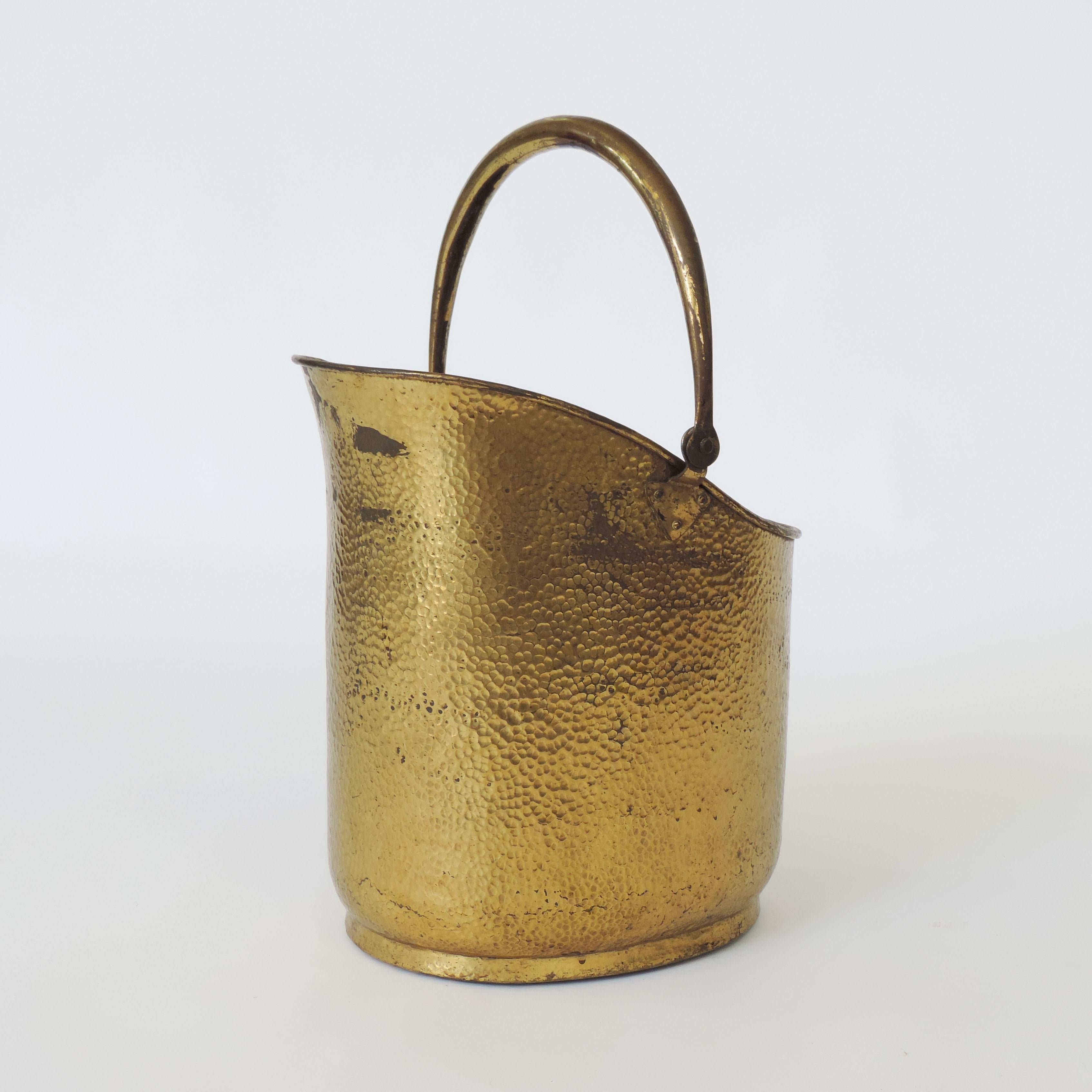 Italian Art Deco firewood bucket in hammered brass, attributed to Gio Ponti.