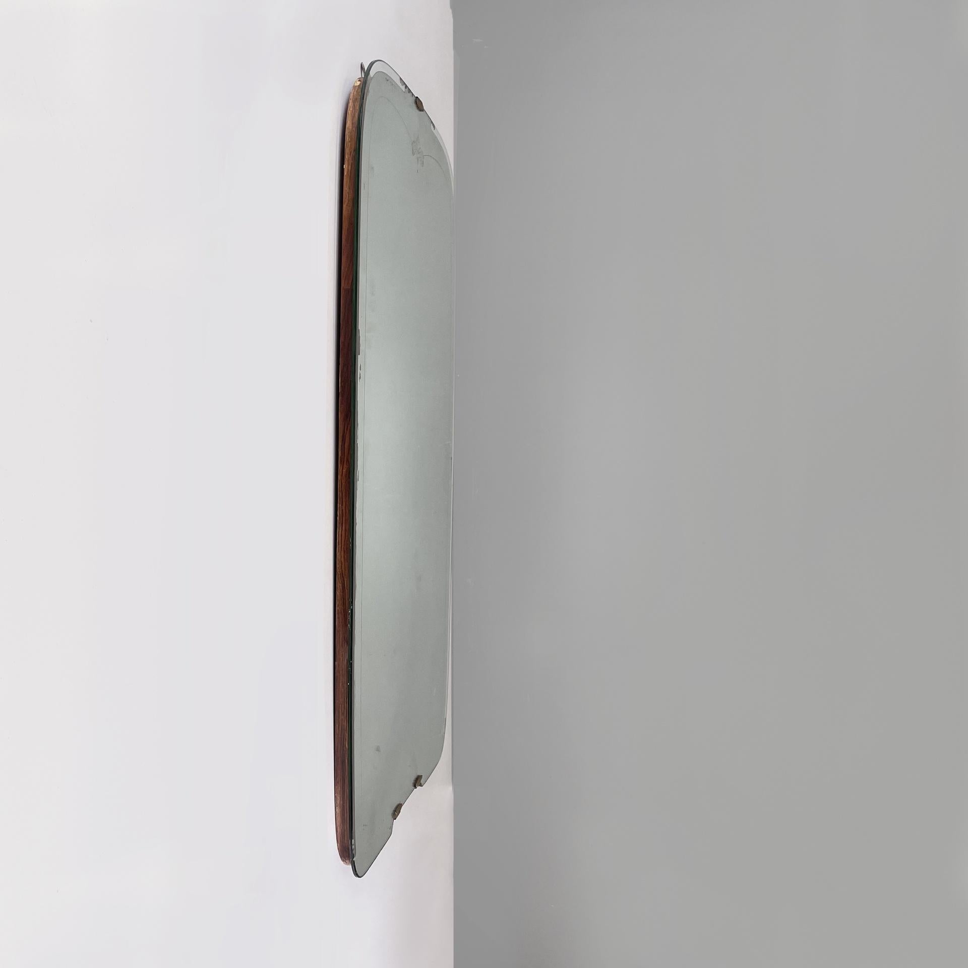 Italian Art Deco full-length wall mirror with brass and glass details, 1940s
Full-length wall mirror with a rounded shape. On the profile it has a white decoration. The edge has a part of transparent glass. The supporting structure is made of wood