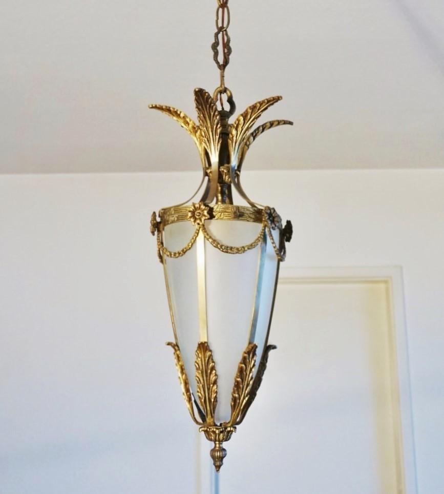 A beautiful Art Deco lantern, Italy, 1920s. Solid bronze and parcel brass with cone-shaped frosted glass shade.
One E27 brass and porcelain light socket for a large sized bulb up to 60W - 100W.
Dimensions:
Total height with chain 41