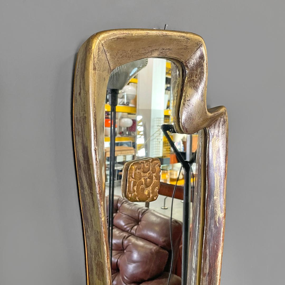 Mirror Italian Art Deco golden wood wall mirror with abstract curved structure, 1940s For Sale