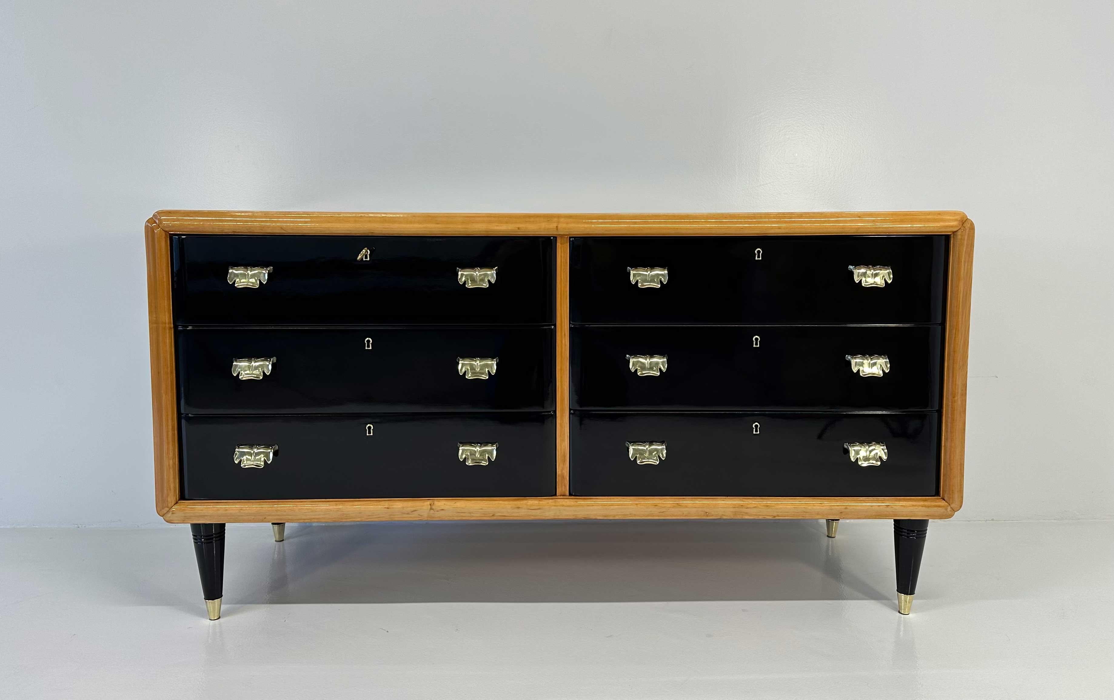 This Art Deco dresser was produced in Italy in the 1940s and it is attributable to the design of Paolo Buffa. It is completely black lacquered with maple profiles and brass handles and leg tips. 
Completely restored. 