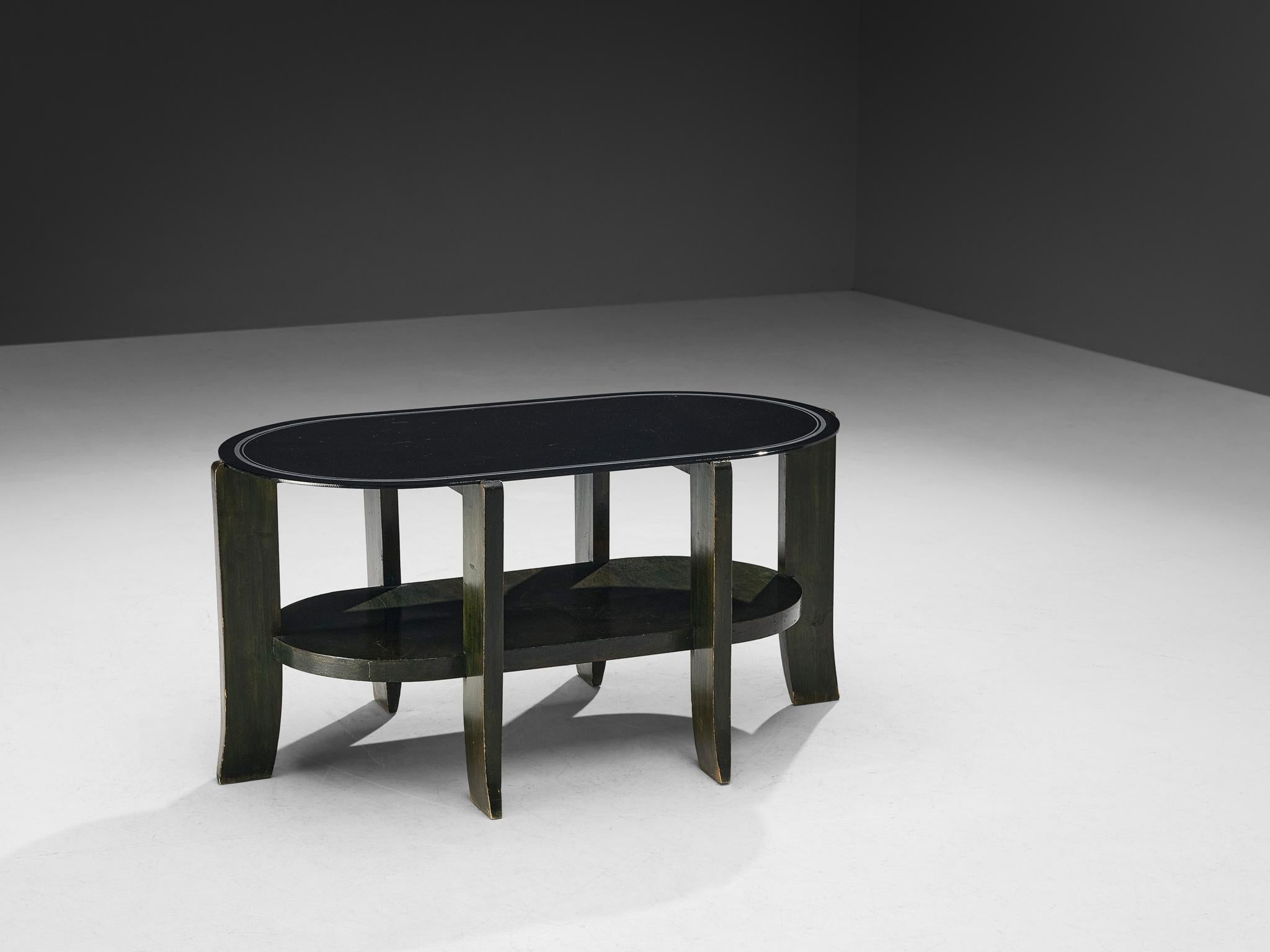 Coffee table, stained wood, glass, Italy, 1940s

This art deco coffee table embodies a stable and strong structure. The double layered feature holds a functional property, yet gives the unit extra dimensionality.  The table is supported by evenly