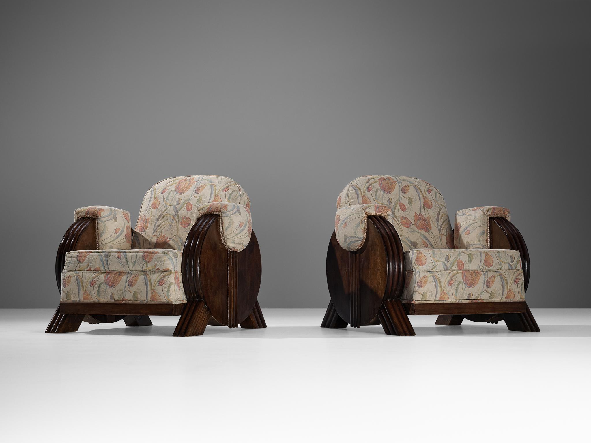 Pair of easy chairs, fabric, stained beech, brass, Europe, 1940s.

These armchairs exude the Art Deco style of the 1940s. With its imposing shapes, this design deserves a prominent place in one's interior. Truly exceptional about this piece are
