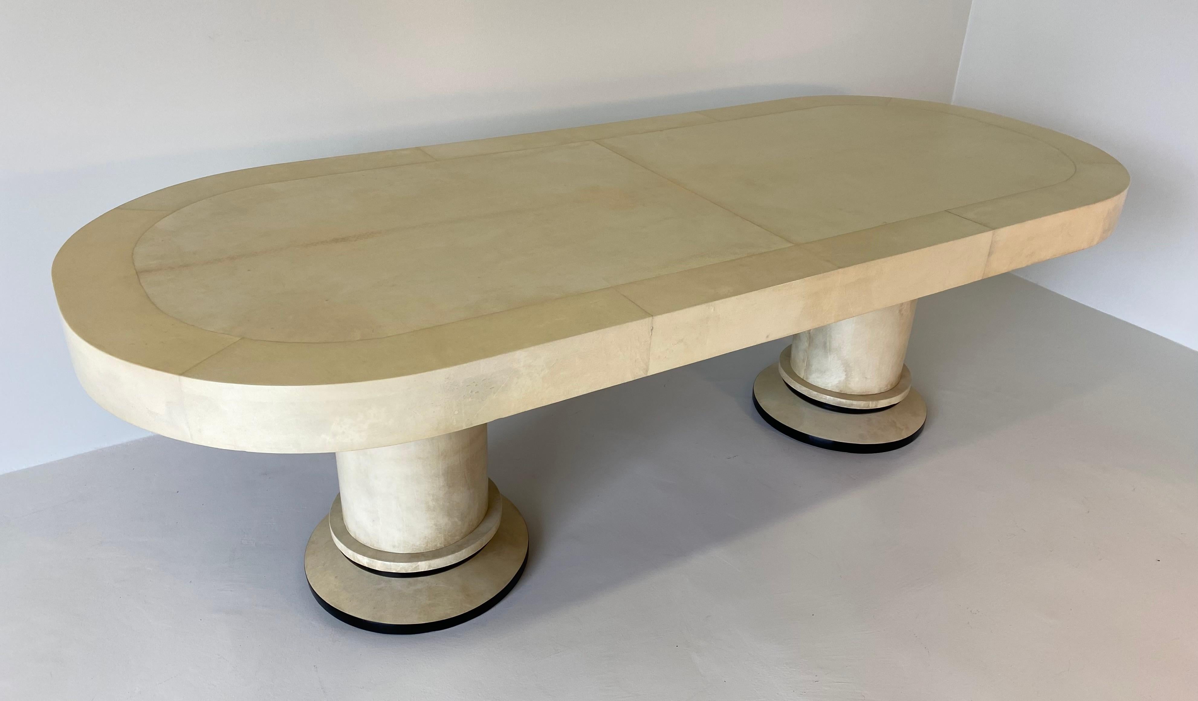 This rare Art Deco dining table was produced in the 1930s in Italy.
The table is completely covered with a precious and elegant parchment.
Base details are black lacquered.
Completely restored.