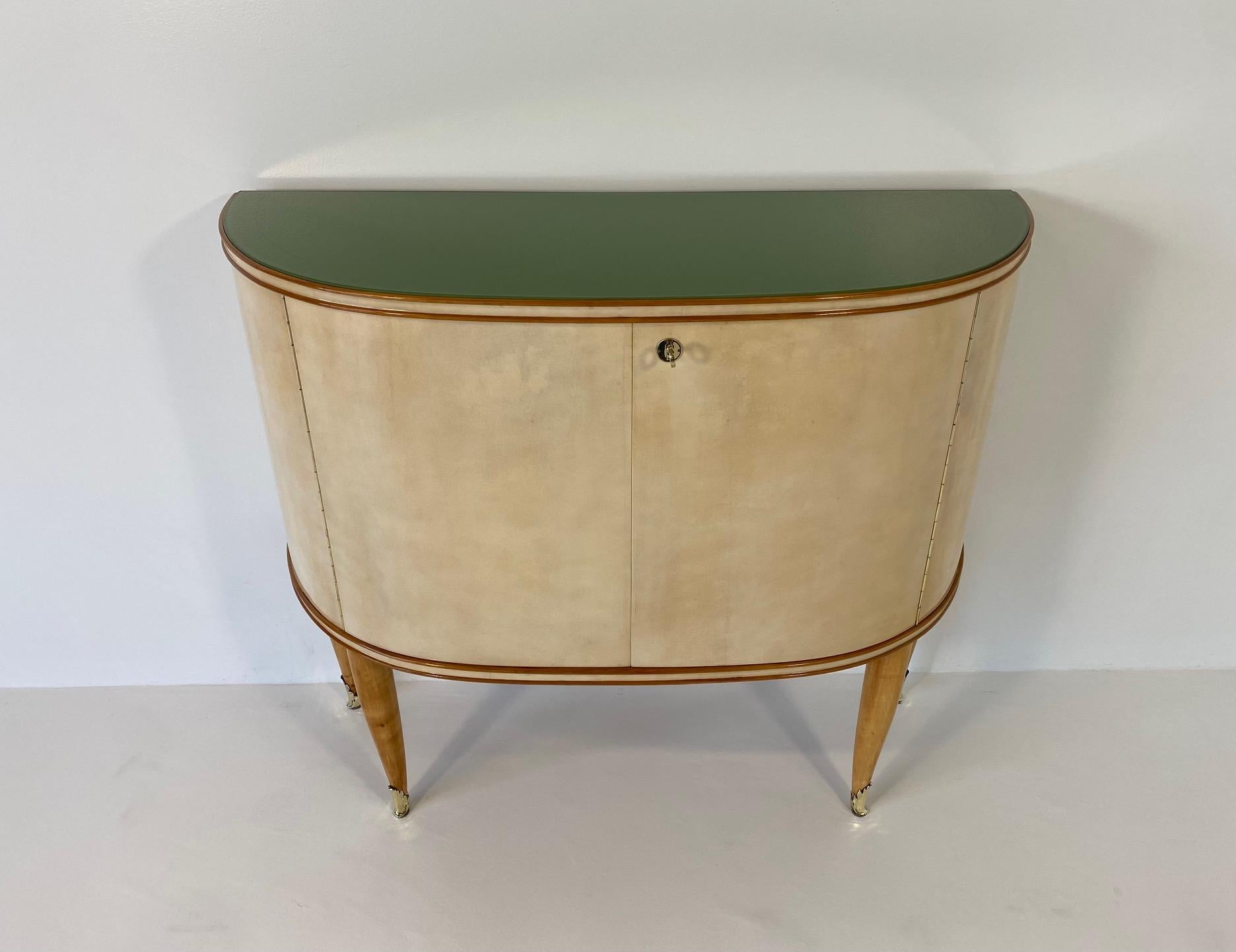 This Art Deco sideboard was produced in Italy in the 1950s, for the exposition ' La Permanente Mobili Cantù'. Cantù is a small village in the north of Italy, that used to be known for wood crafting and great furniture making.

The doors and the