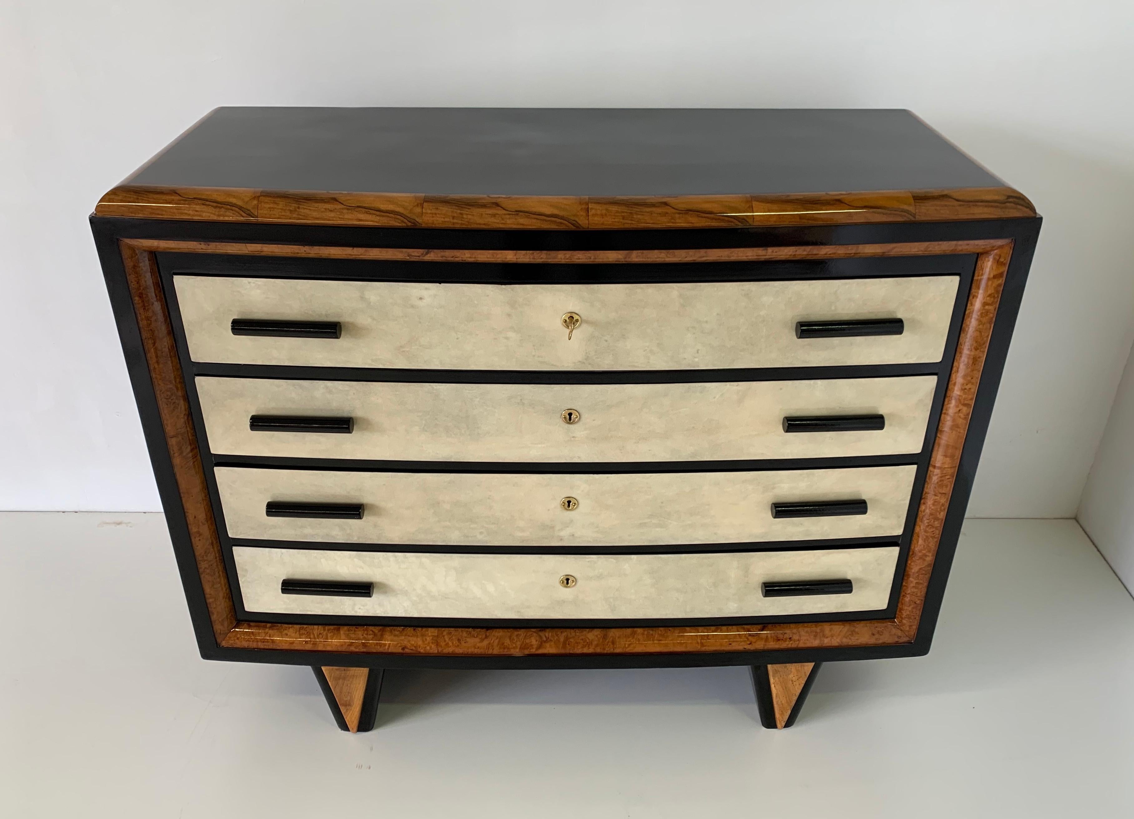 Italian dresser from the 1930s produced in Italy.
The front of the drawers are in parchment while the profiles are in walnut.
The structure and handles are in black lacquered wood.
Metal parts in brass.
Completely restored. 
   