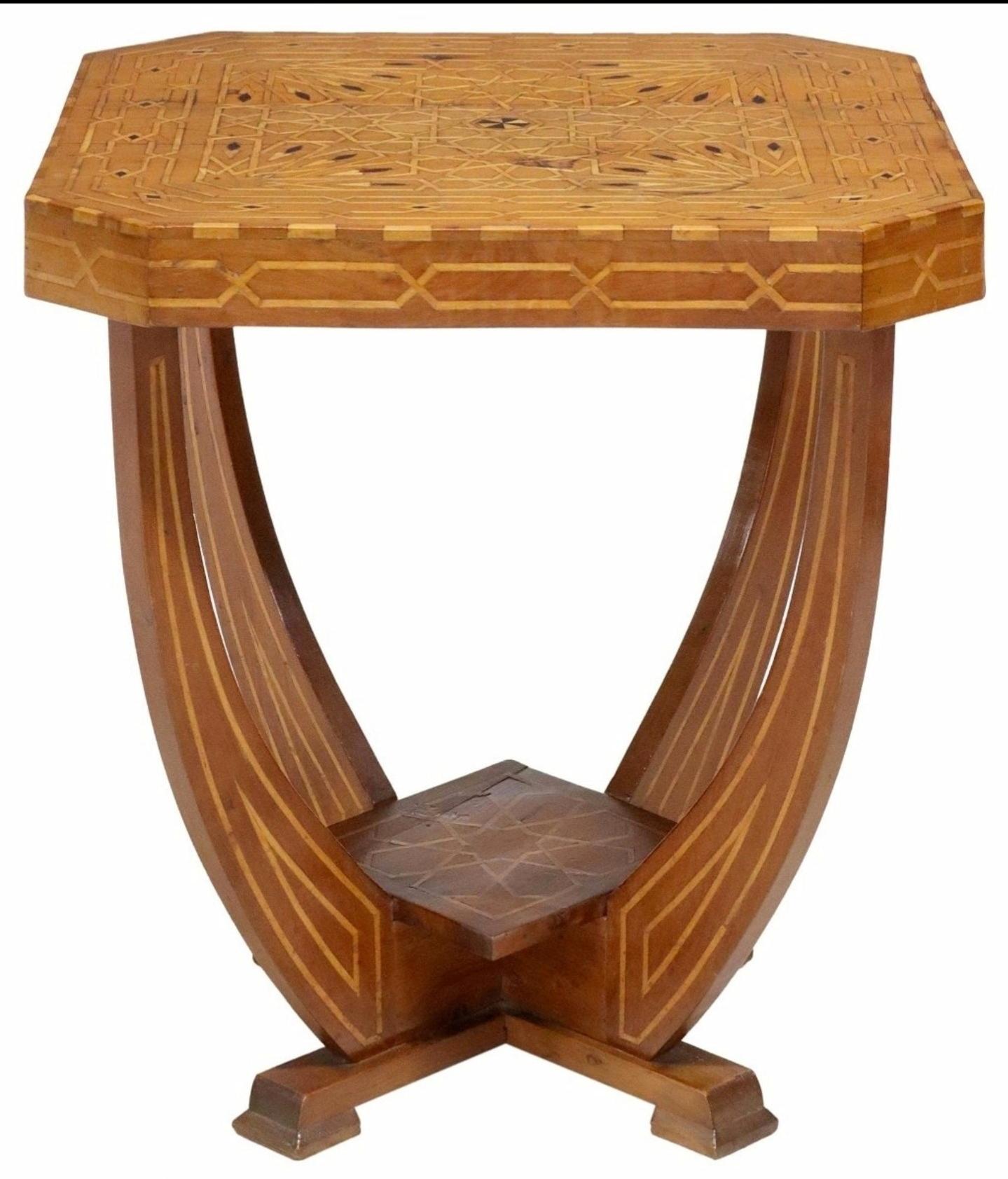 A magnificent period Italian Art Deco Moderne elaborately inlaid table. circa 1930 

Finely hand-crafted in Italy, most likely the Sorrento - Naples region of Southern Italy, featuring a walnut two-tier design with intricate contrasting maple and