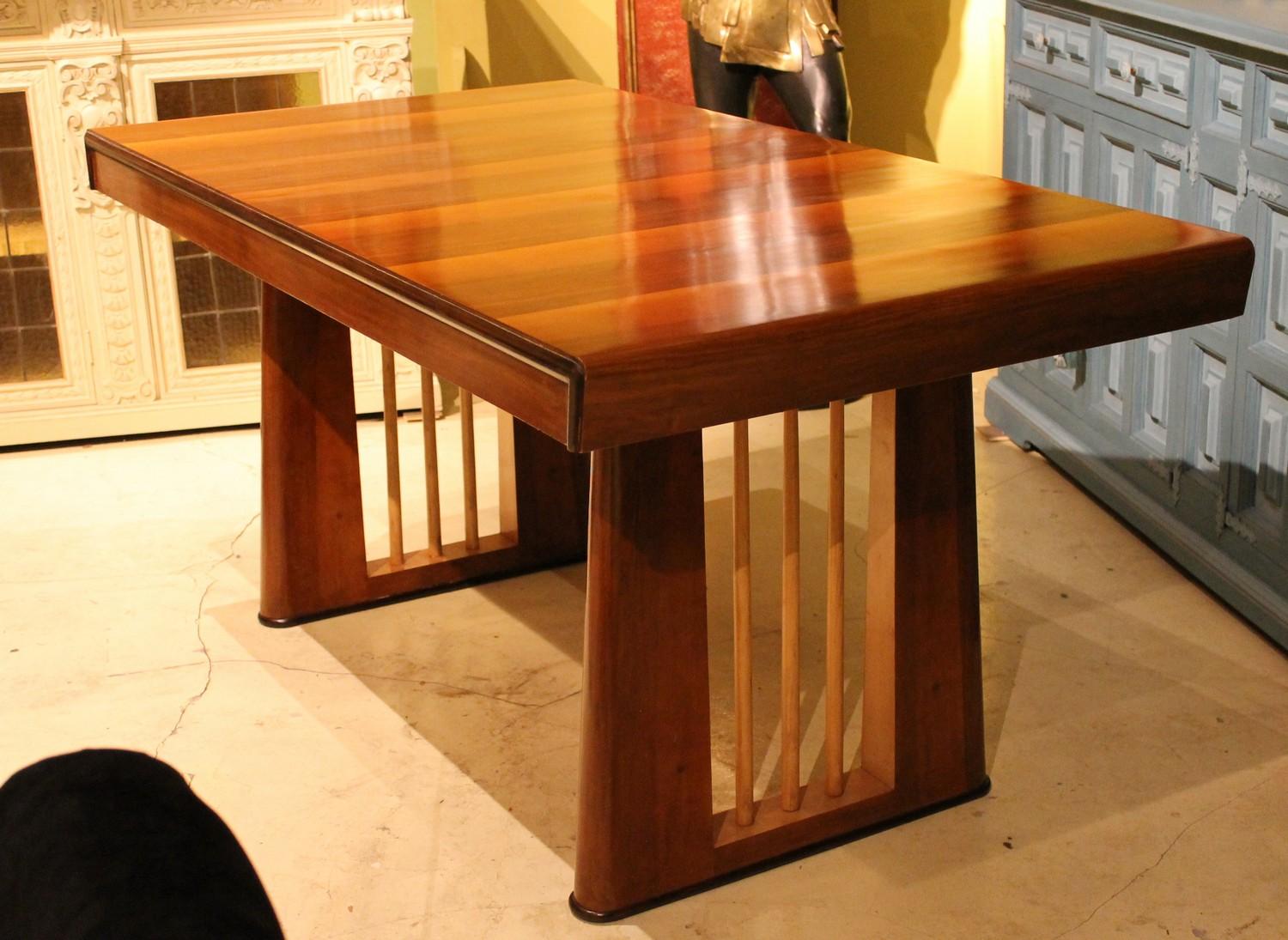 This gorgeous modern Italian early 20th century Art Deco period table features wonderful wood grain and a unique sculpted open worked pedestal legs of great visual impact whether used as a desk or as a wall console or center table
The tabletop has