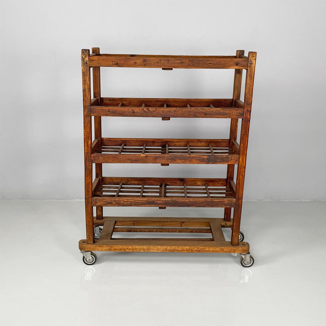 Italian art deco rectangular wooden cart, 1920s
Cart with four rectangular shelves, entirely made of wood.
Each shelf has several flat and round section slats. The legs, joined in the center by slats, have wheels as feet.
1920s
Vintage condition,