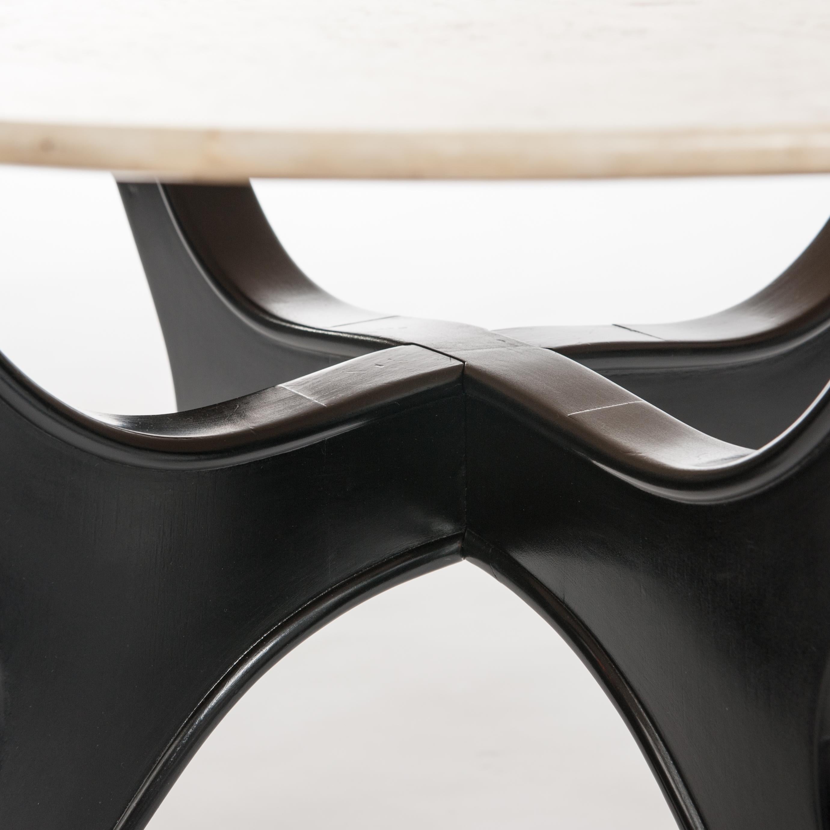 Elegant Italian Mid-Century side table, four solid wooden black ebonized legs with crème-beige colored marble top.
The base could be dismounted into 2 parts, the top is fixed on the base by screws.
The edges of the base are profiled (1.3cm) the