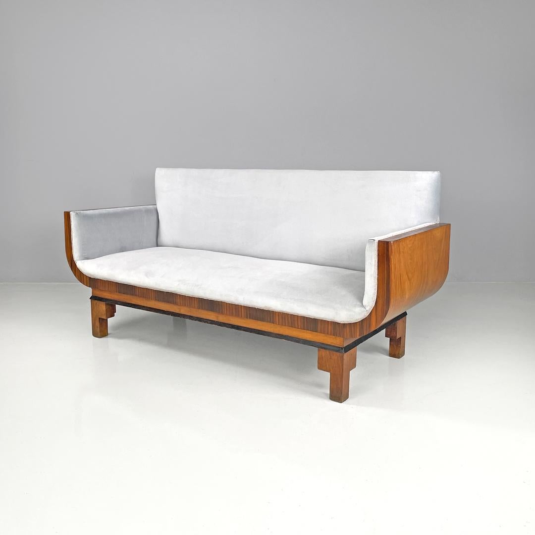 Italian Art Deco sofa in wood and light blue pastel velvet, 1930s
Sofa in wood and fabric. The wooden structure is curved and rounded and makes up the supporting structure and the two armrests. The seat, armrests and backrest are padded and covered