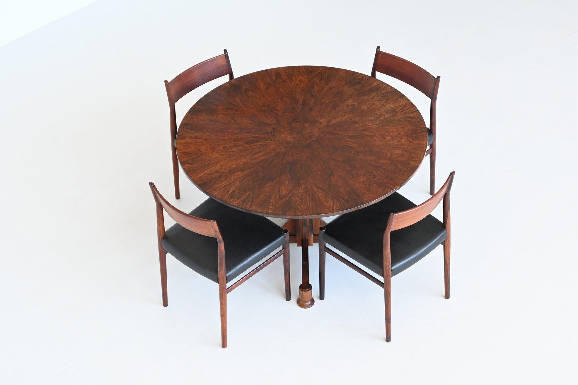 Amazing Art Deco Fratelli Proserpio style dining table by unknown designer or manufacturer, Italy 1960. This wonderful unique table featuring a round shaped top which is supported by a sculptural pedestal. The rosewood veneered top shows a beautiful