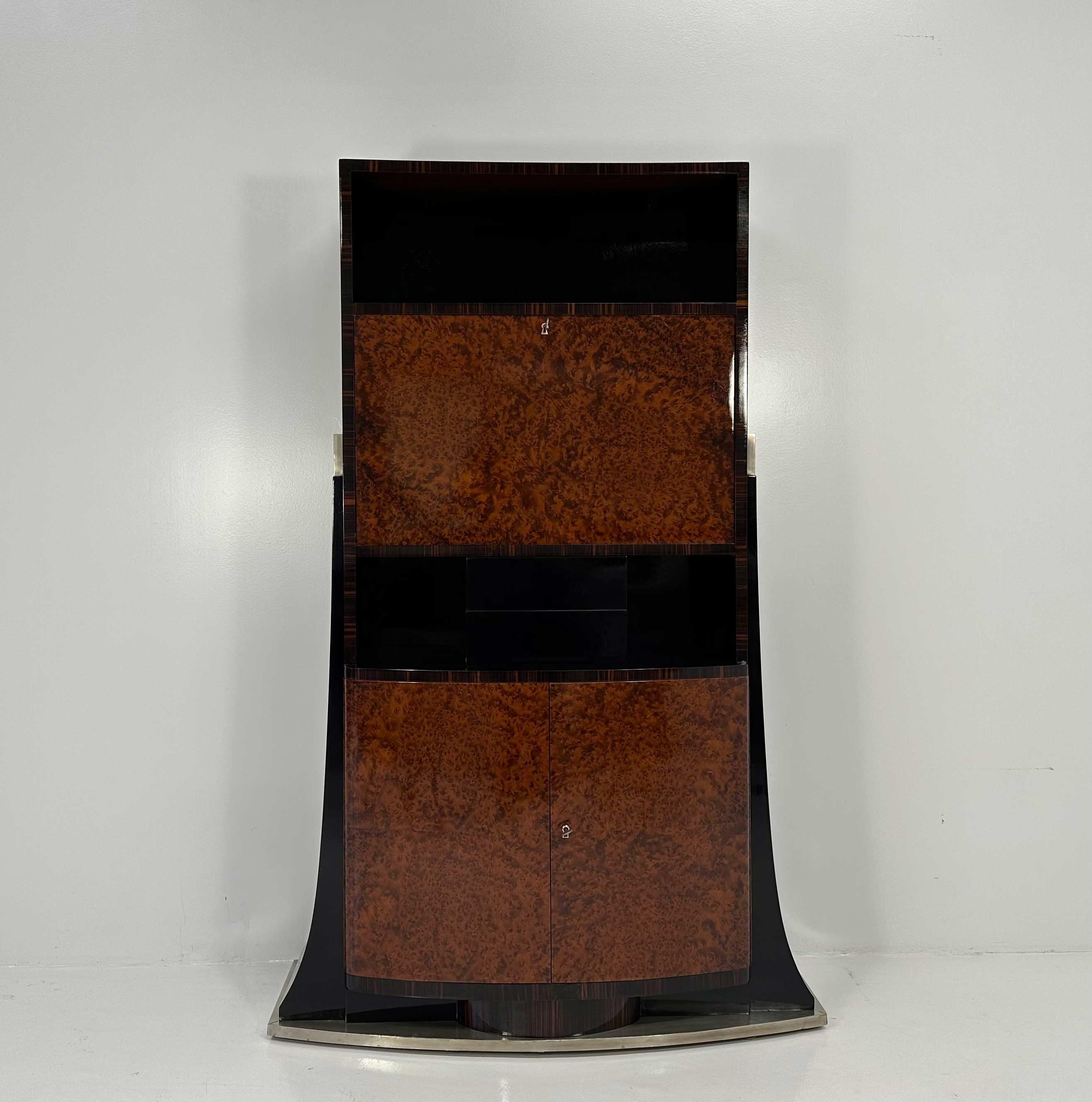 This elegant Art Deco cabinet was produced in Italy, more precisely in Meda (Near Milan) in 1935. On the back of the mirror there is a big label that certify its geographical provenience and the date of manufacture. 
The laterals, the inside parts