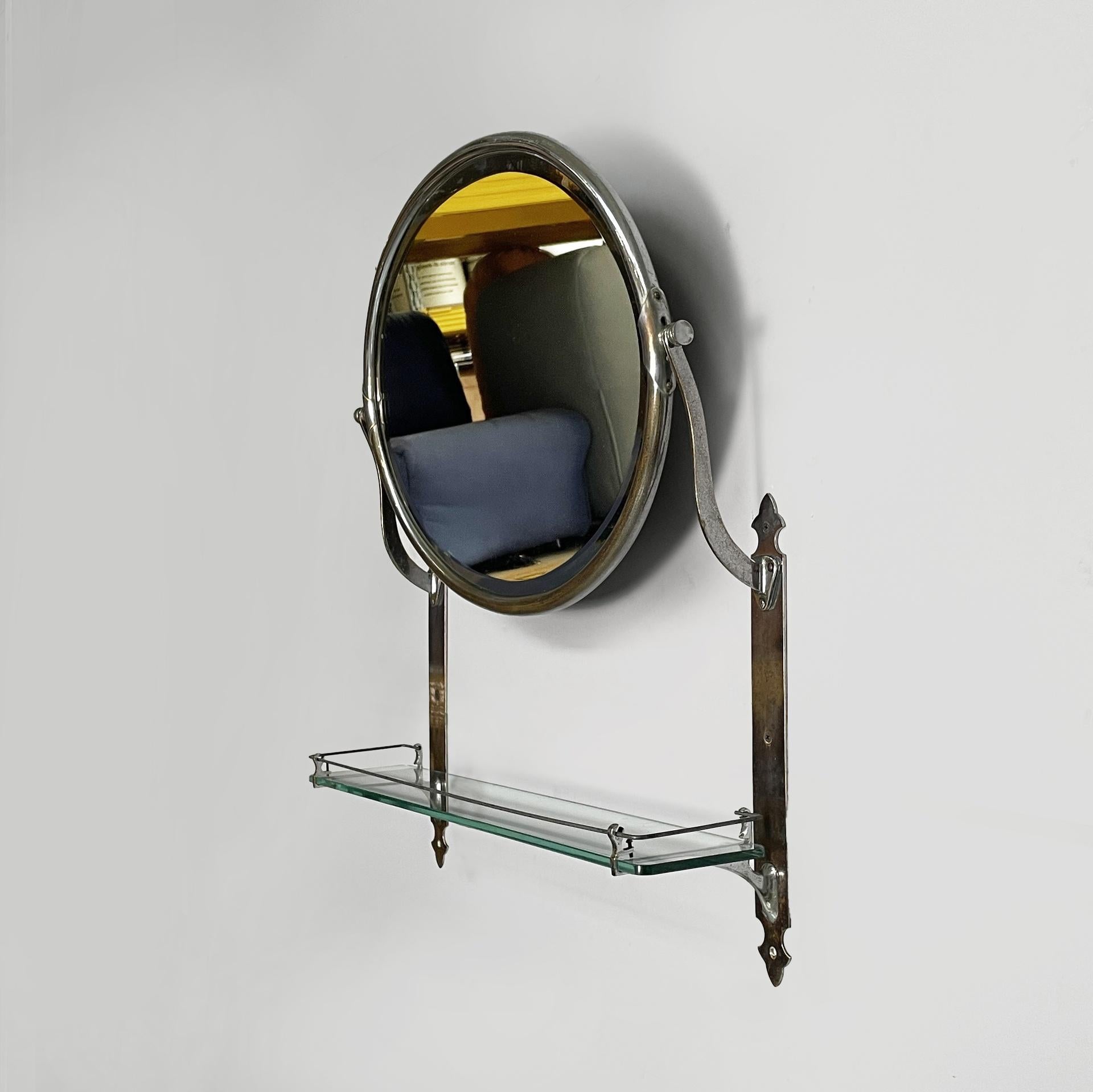 Miroir mural inclinable italien Art Deco avec étagère en verre et métal, années 1930
Miroir mural inclinable avec cadre tubulaire en métal chromé. La structure du miroir est constituée de bandes de métal chromé. Sous le miroir se trouve une étagère