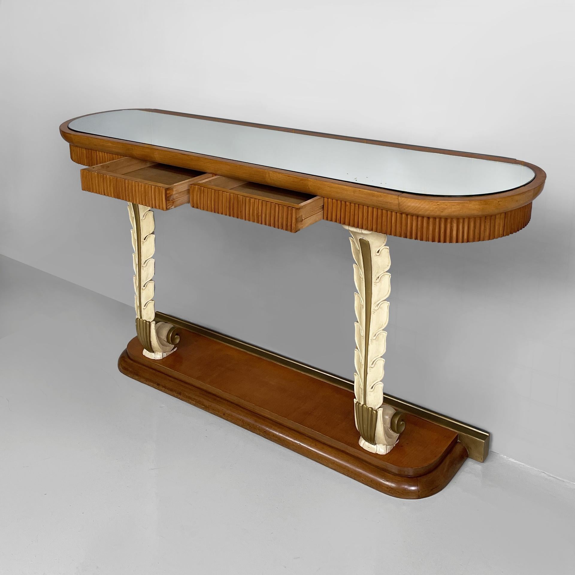 Italian Art Deco wall console in wood and mirror, 1940s
Vintage and fantastic wall console table with an oval top with wooden profile and and mirror. The grissinato wood front features two drawers. The top is supported by two feather-shaped columns
