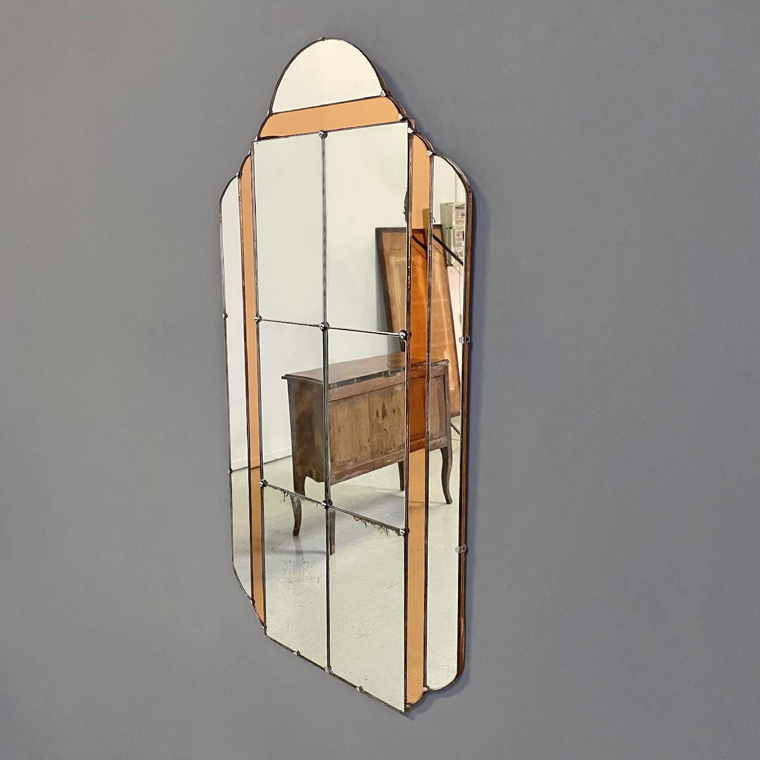 Italian Art Deco wall mirror with peach colored parts, 1930s
Rectangular Art Decò wall mirror with rounded profiles. The mirror is composed of several mirrors joined together by small hemispherical parts in silver metal. In the upper part the
