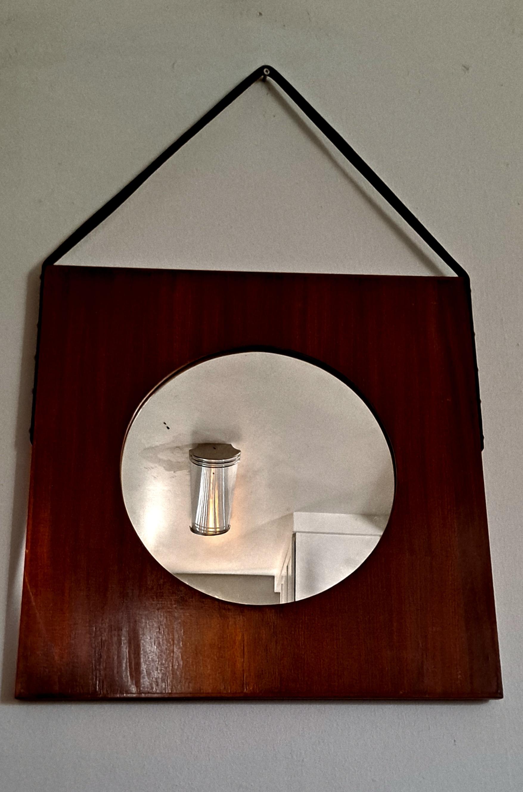  Art Deco wall round mirror with square wood frame .Mirror is hanging on the leather strap. Height with the leather strap is  34 inches. Mirror is tarnish in original condition as shown on the photos .