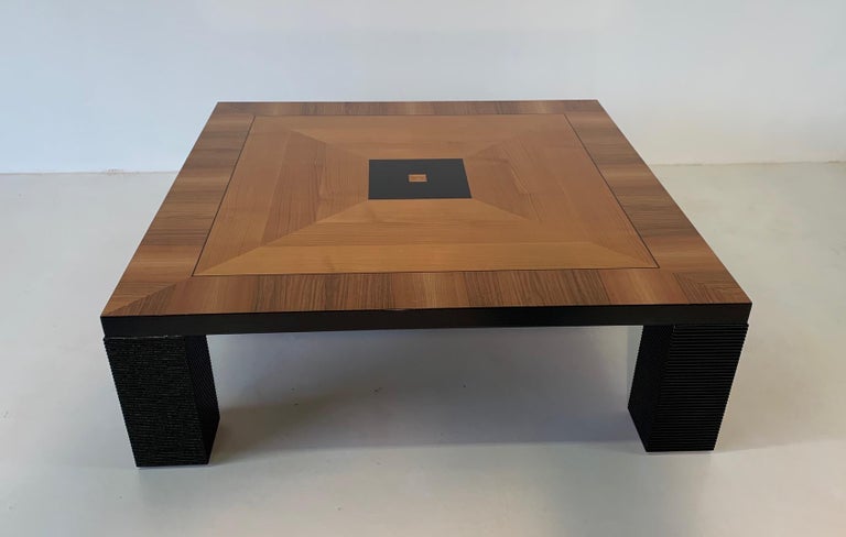 Great Italian coffee table in Art Deco style.
The top is inlaid in walnut with black lacquer decorations while the legs are in black worked wood.