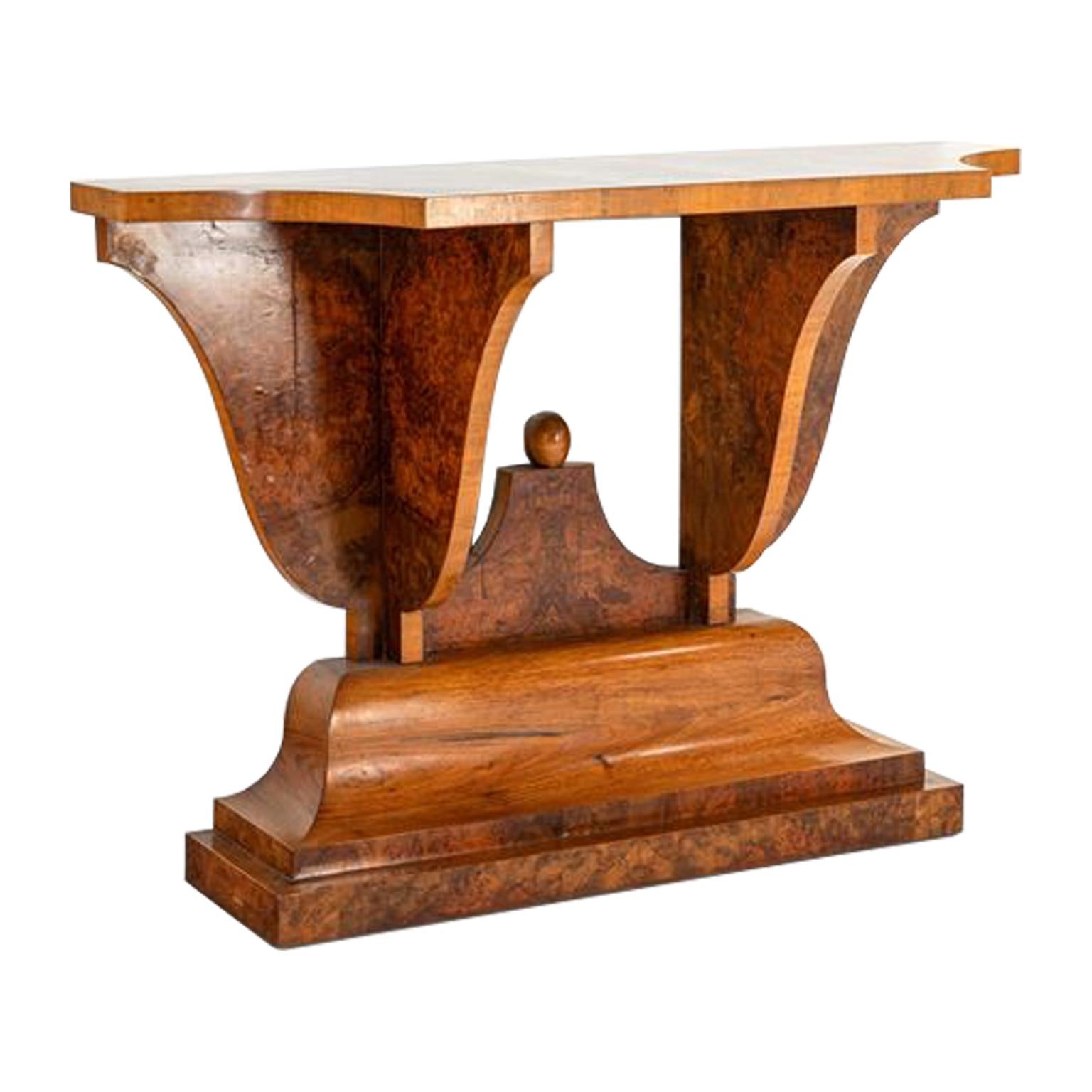 This ornate Italian Art Deco console features unique curved details throughout. The intricacy is echoed in the beautiful grain of the light European Walnut Burl and Rosewood accents used on this piece. Original Condition.