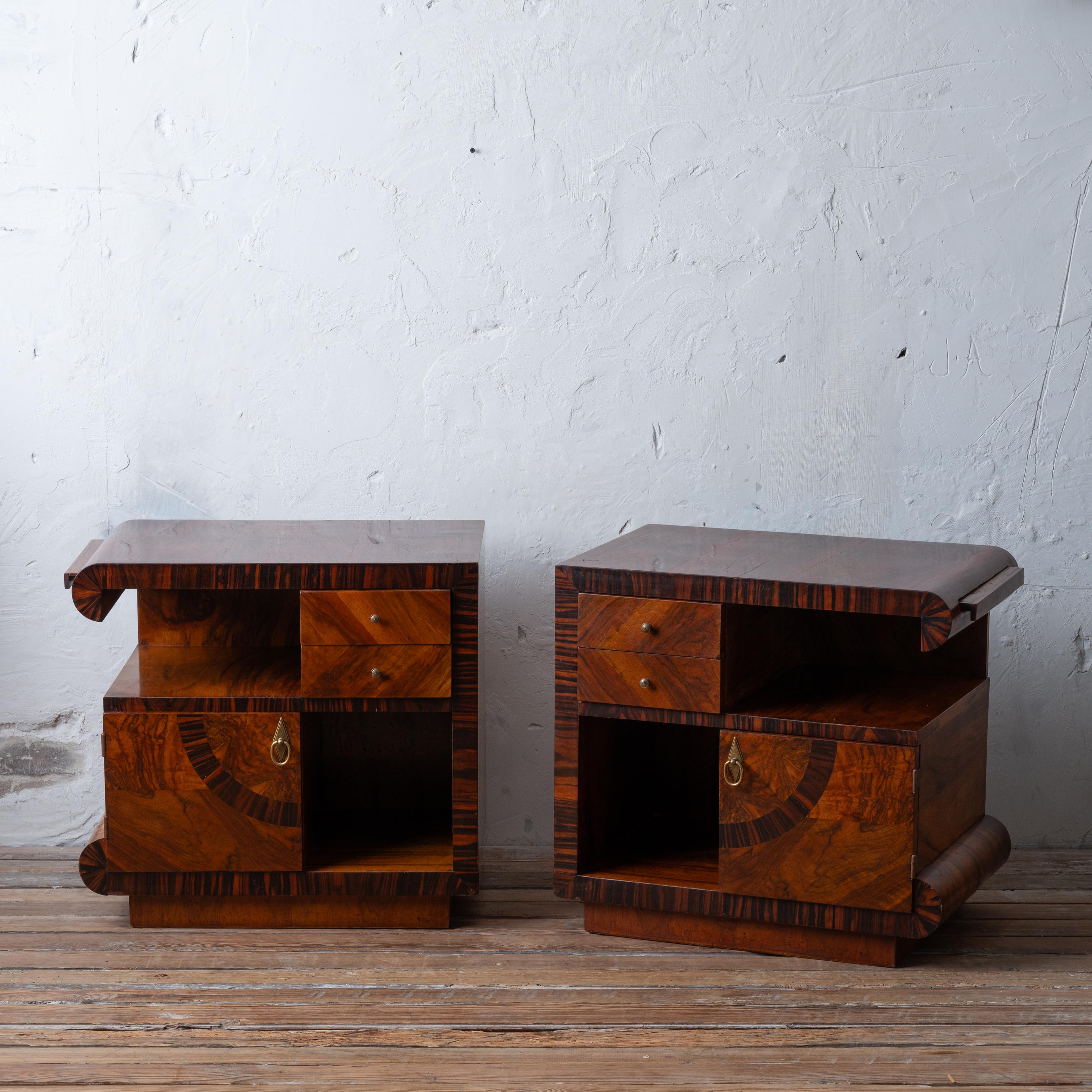A pair of Italian Art Deco night stands in walnut, 1930s.

25 ¼ inches wide by 17 inches deep by 23 inches tall

