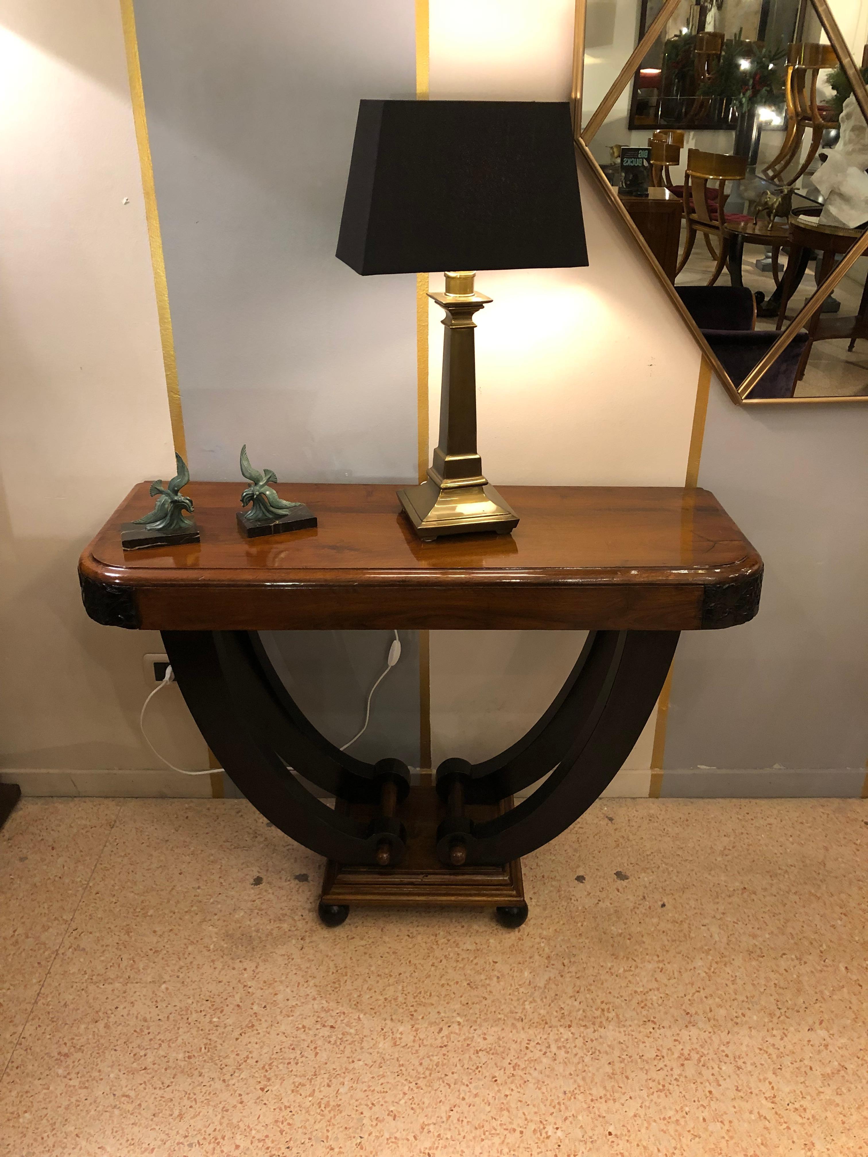 A table console with versatile size , W 110 cm, D 40 cm, H 71 cm which comes from Italy from late 1930s period. It is typical from Art Deco period and style with very geometric shape and line. It is in walnut wood with some black ebonized details
