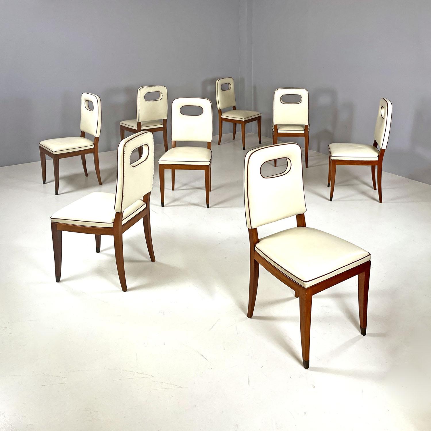 Italian Art Deco white leather and wood chairs by Giovanni Gariboldi, 1940s
set of eight chairs with rectangular seat with wooden structure. The seat and back are padded and covered in white leather with brown leather profiles, fixed to the