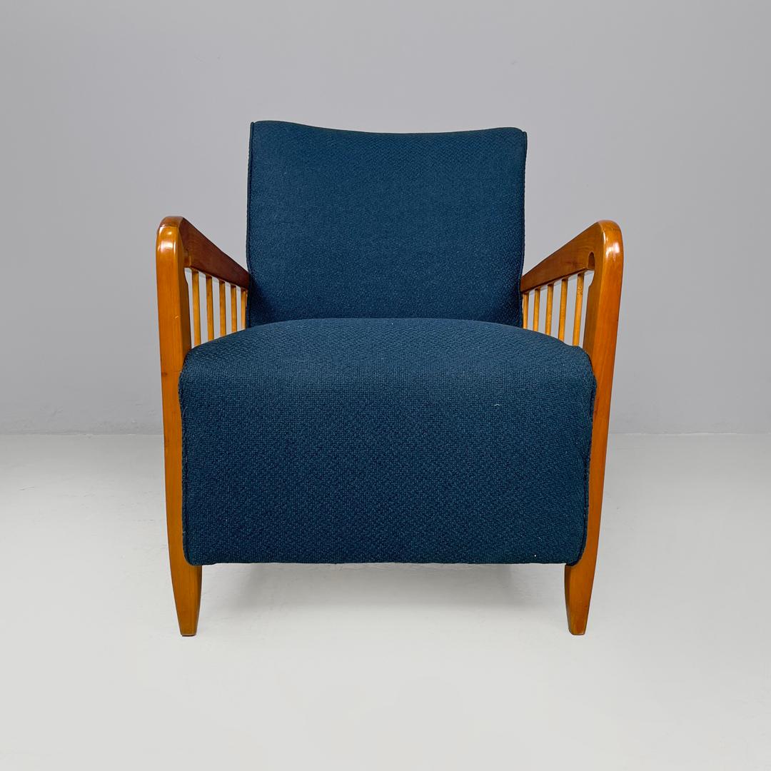 Italian Art Deco wooden armchairs in blue fabric with armrest, 1940s  
Pair of padded armchairs upholstered in blue fabric. The structure is made of wood, the two armrests have five decorative strips that join them to the structure. With four