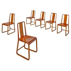 Italian Art Deco wooden chairs with rounded structure and rectangular back 1930s