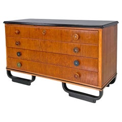 Italian Art Deco wooden chest of drawers with black top and arched feet, 1930s