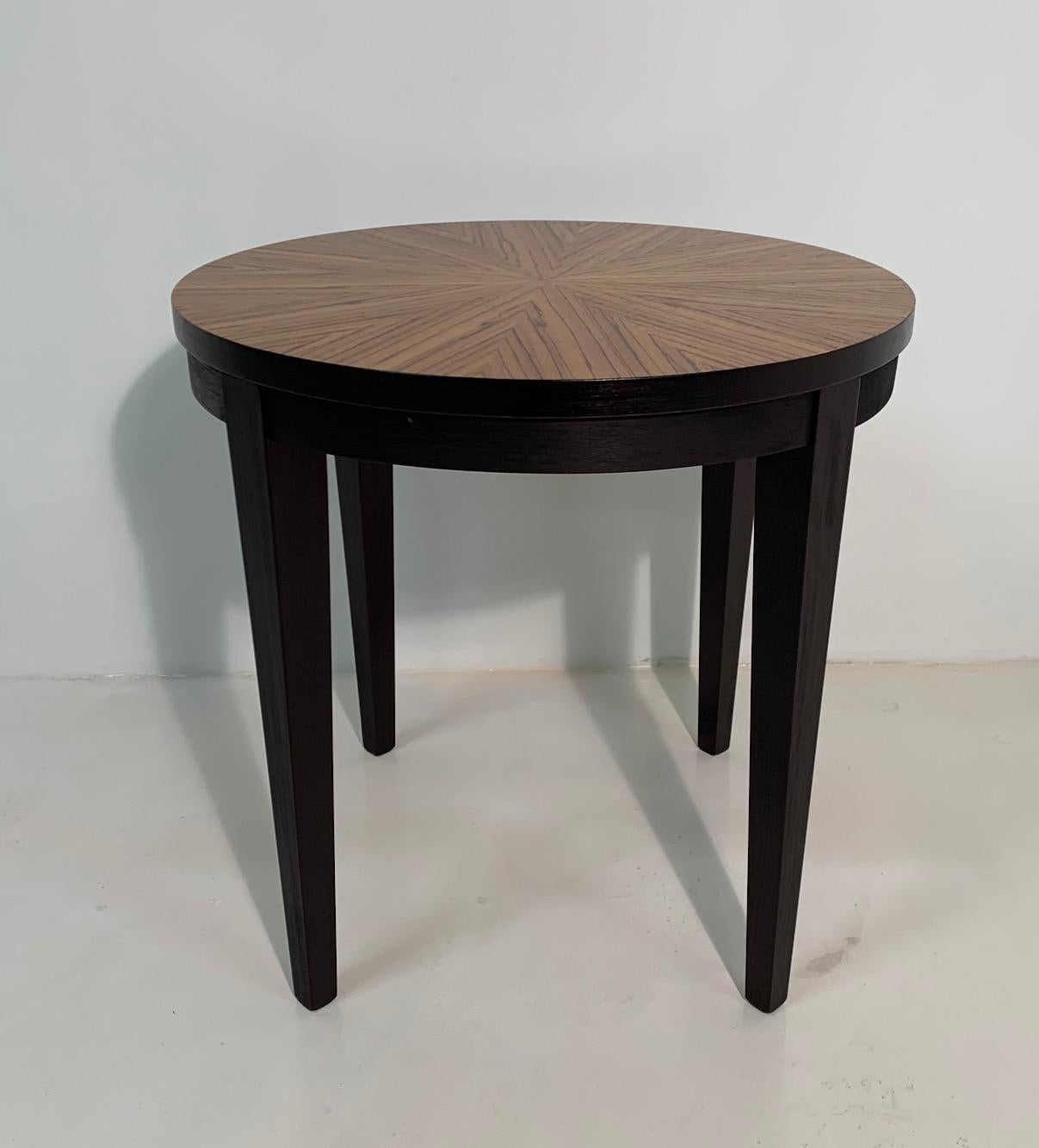 This Art Deco style coffee table was produced in Italy, Zebrano top and black lacquered legs.
Totally restored.
