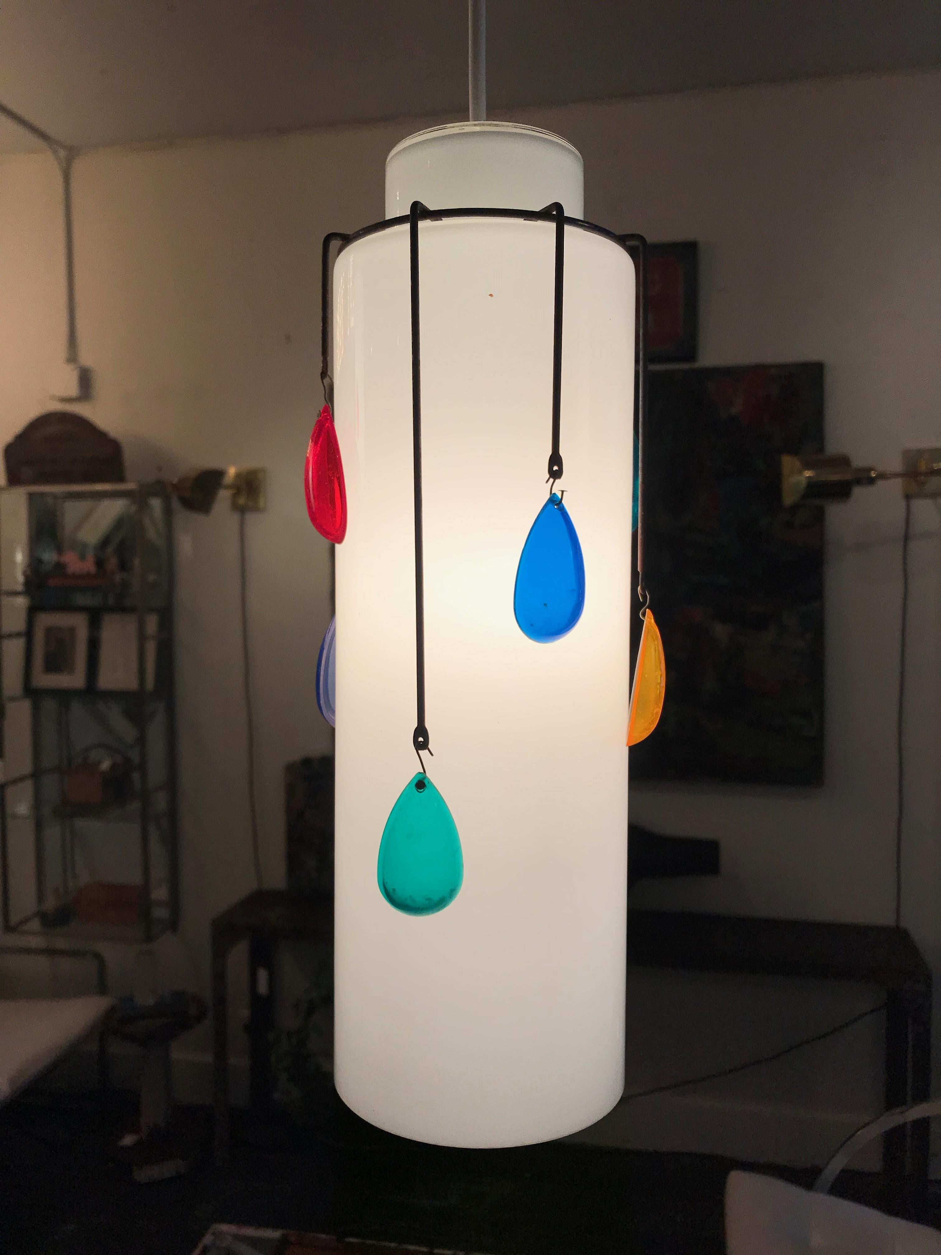 This is a lovely set of three milk glass gem pendant lights from Italy circa 1960 with colorful jewel tone Lucite drops.