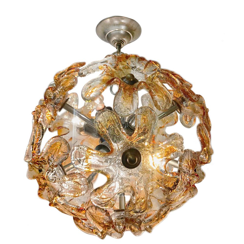 A circa 1960s Italian nickel-plated light fixture with amber and clear glass insets with 10 candelabra interior lights.

Measurements:
Present drop: 22